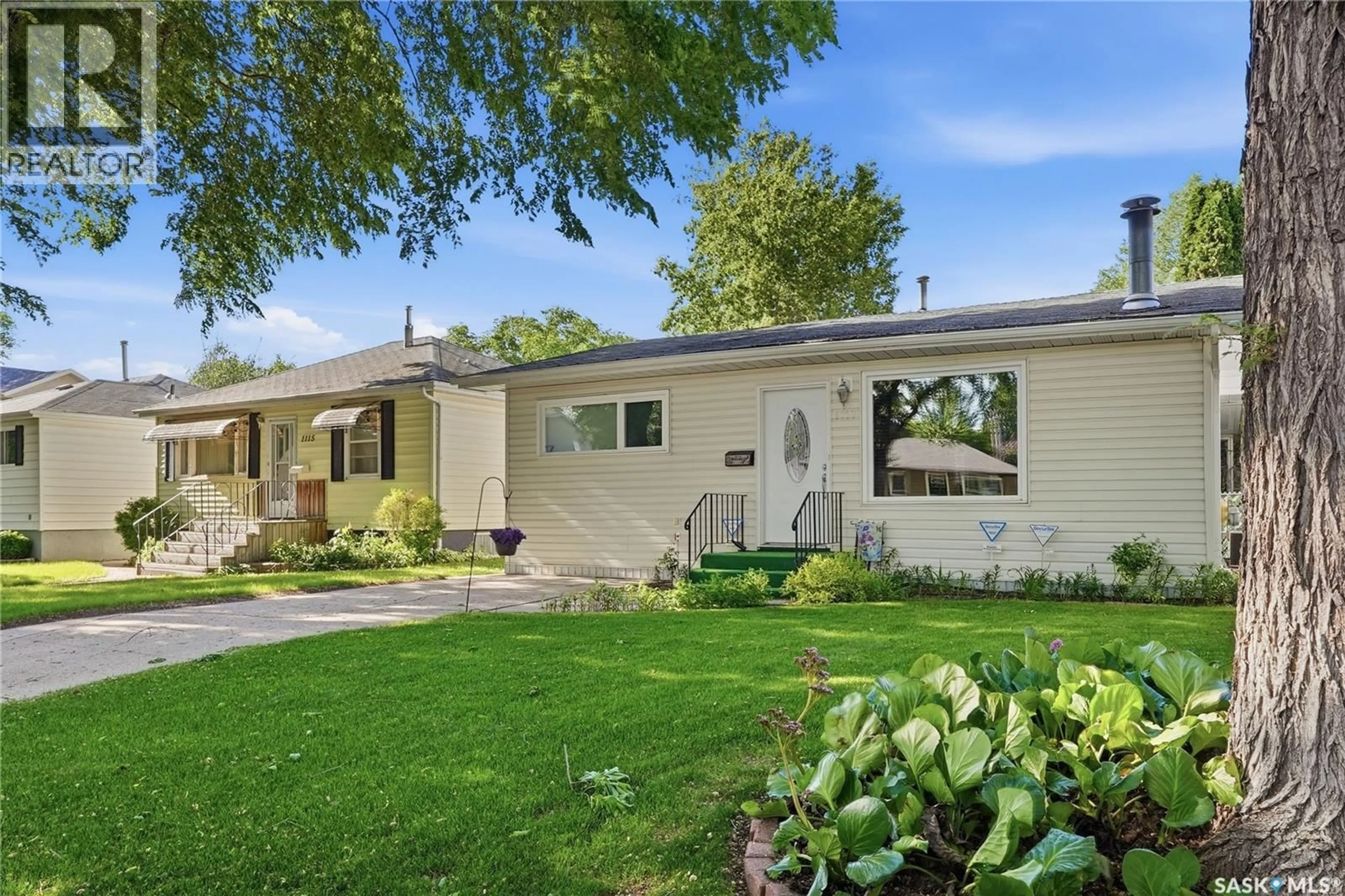 Home with vinyl exterior material, street for 1117 5TH STREET, Saskatoon Saskatchewan S7H1H4