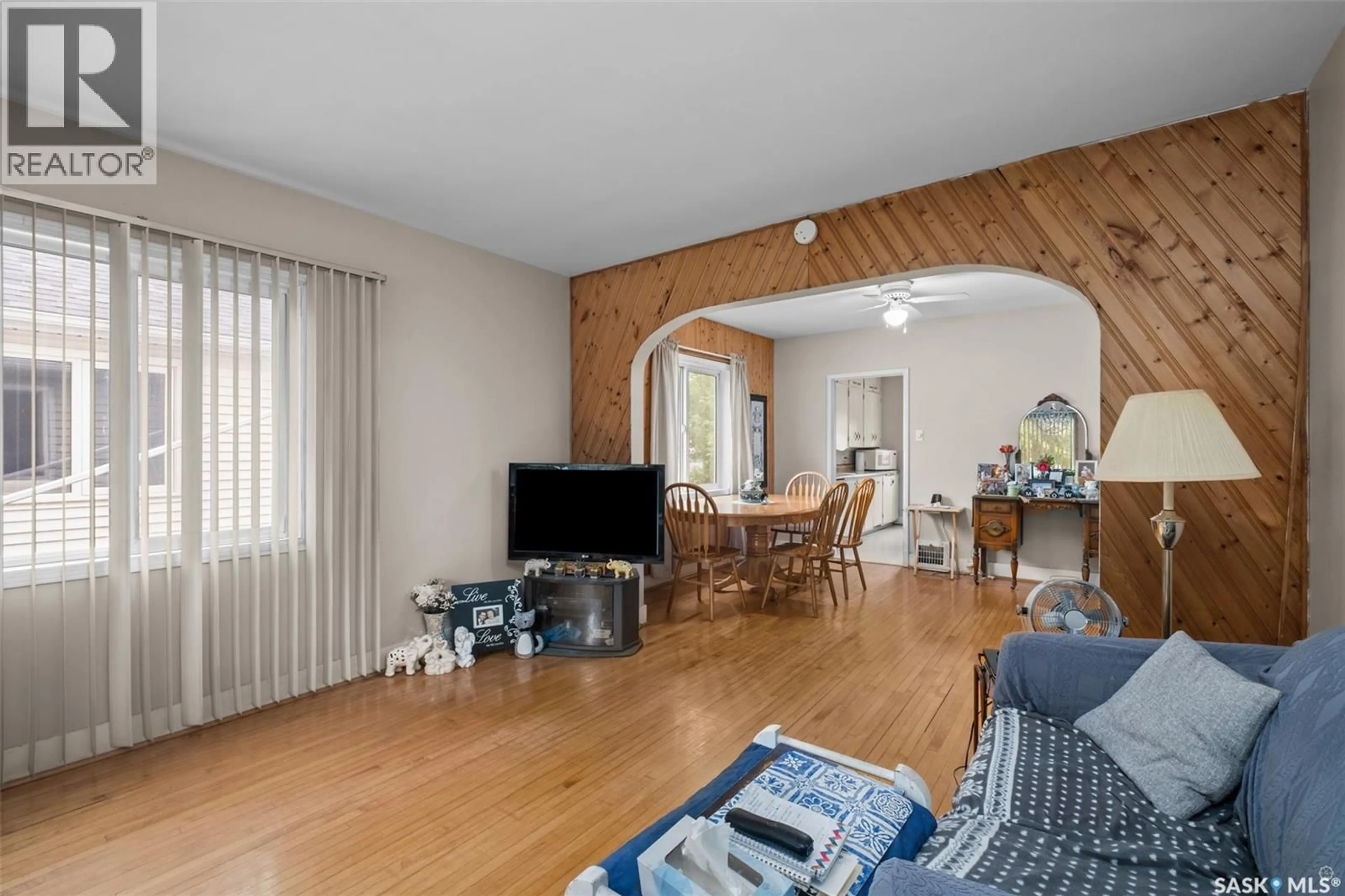 Living room with furniture, wood/laminate floor for 361 14TH STREET, Prince Albert Saskatchewan S6V3L6