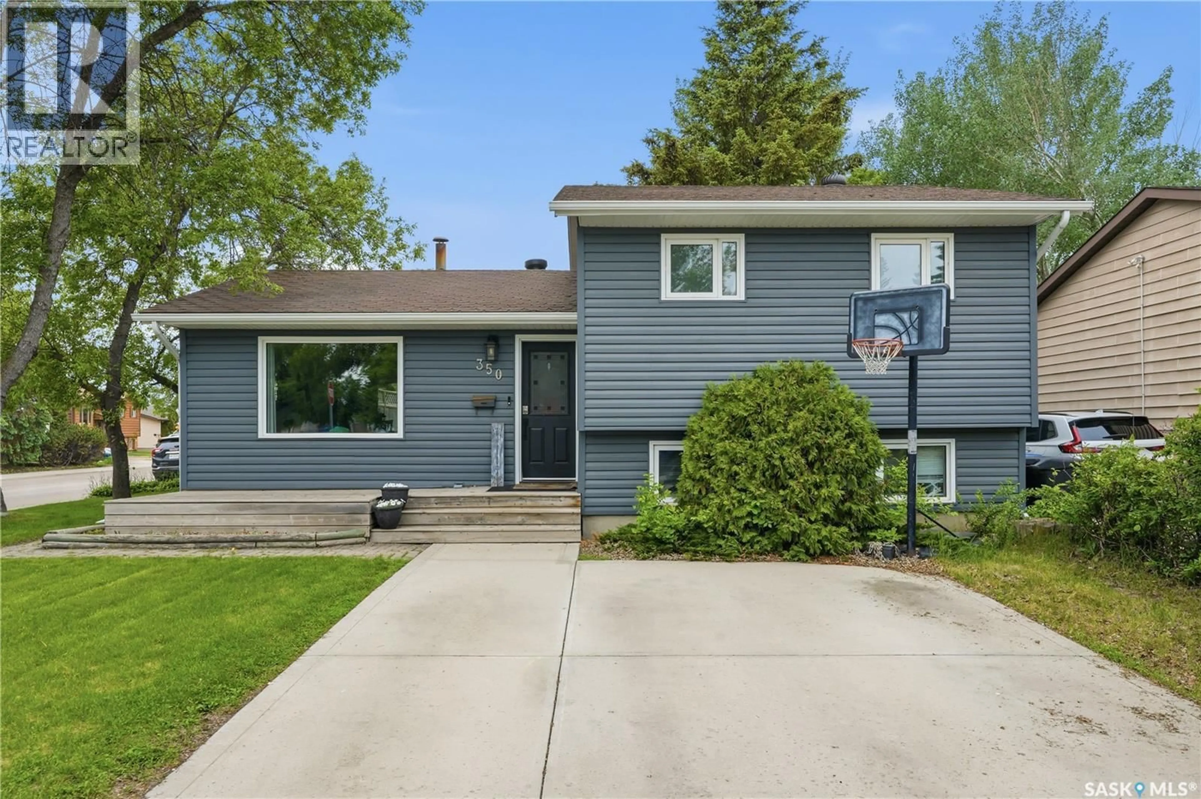 Home with vinyl exterior material, street for 350 WEYAKWIN DRIVE, Saskatoon Saskatchewan S7J4H5