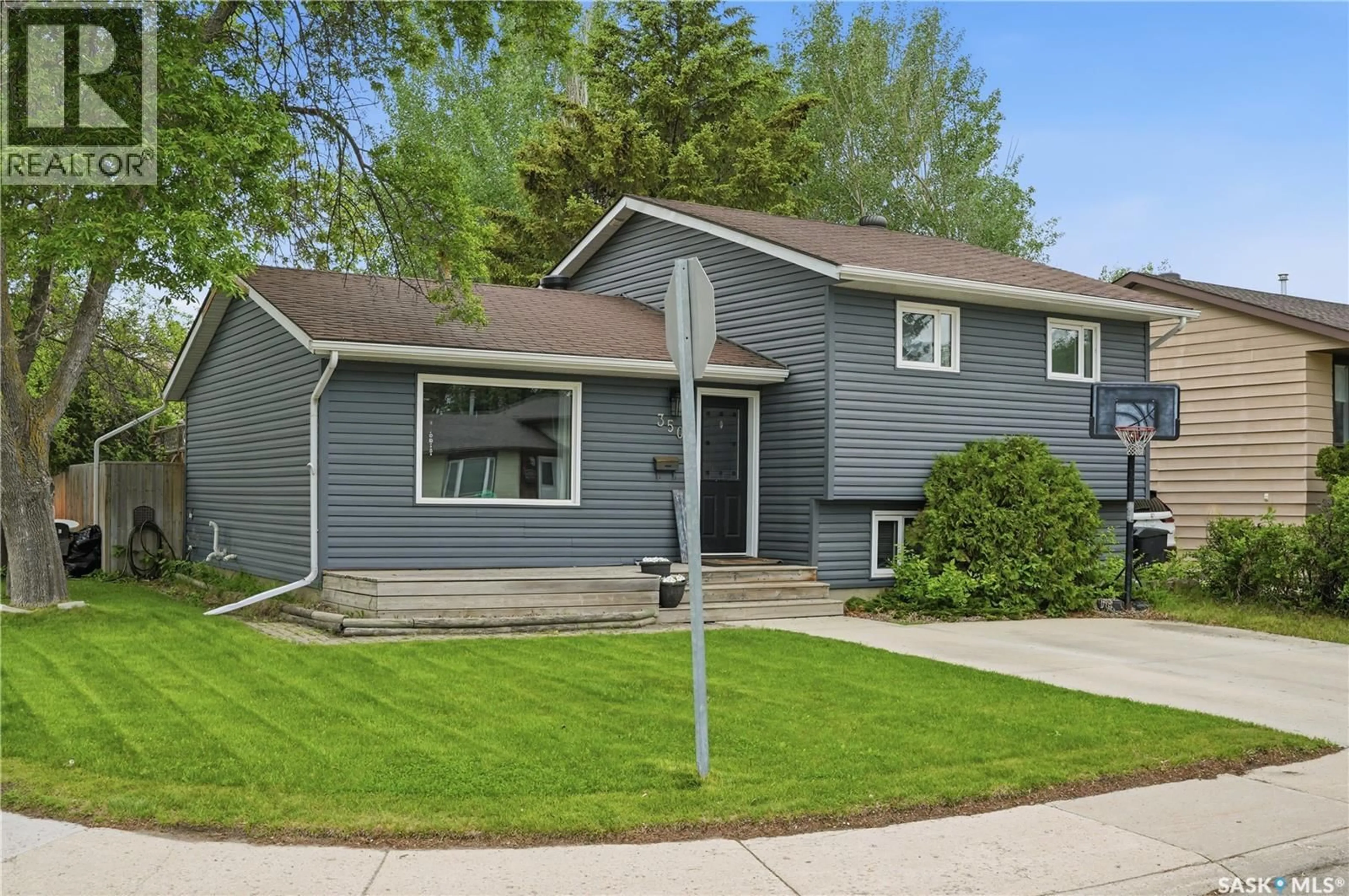 Home with vinyl exterior material, street for 350 WEYAKWIN DRIVE, Saskatoon Saskatchewan S7J4H5