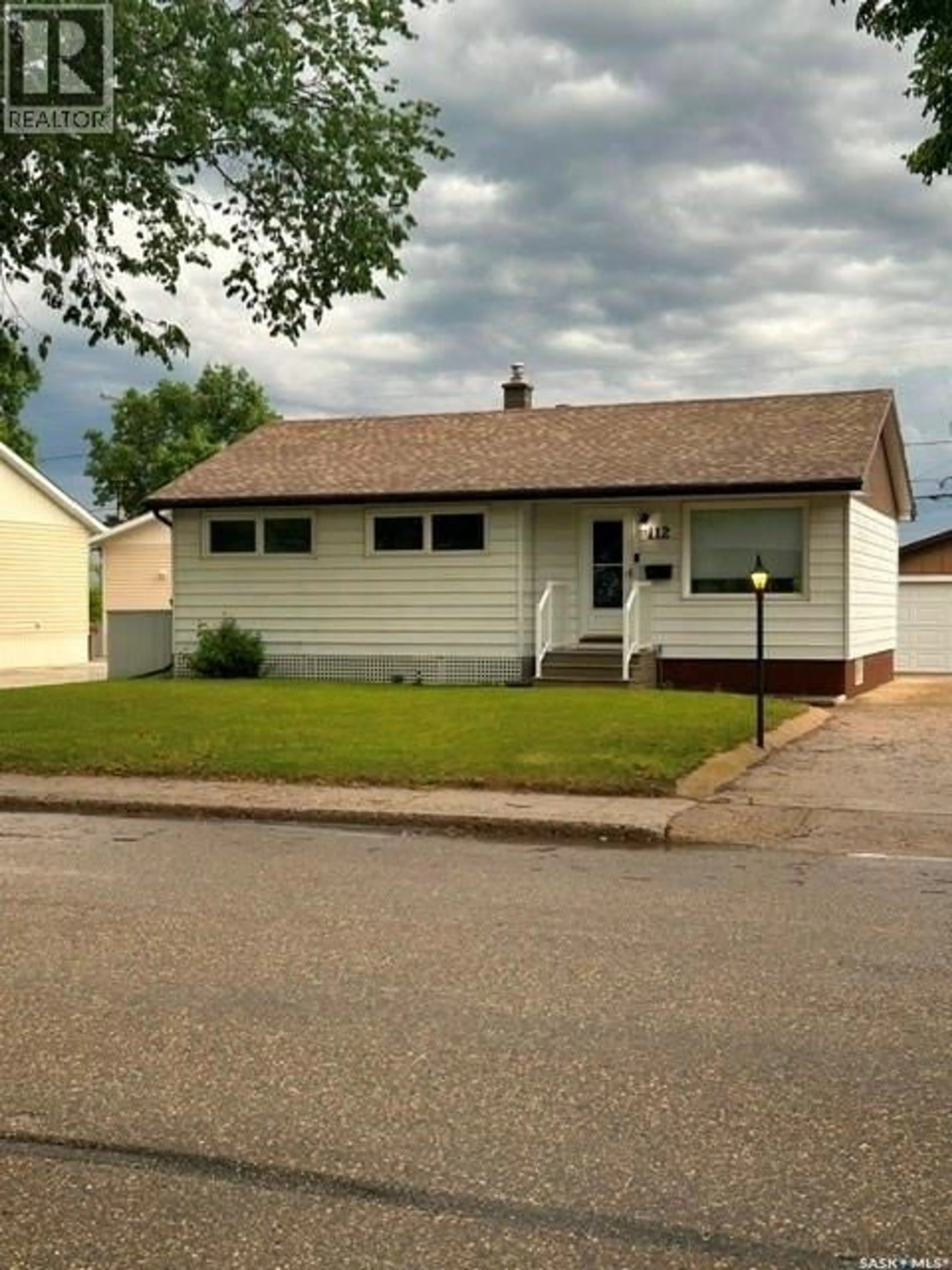 Home with vinyl exterior material, street for 112 MCDONALD ROAD, Estevan Saskatchewan S4A0B8