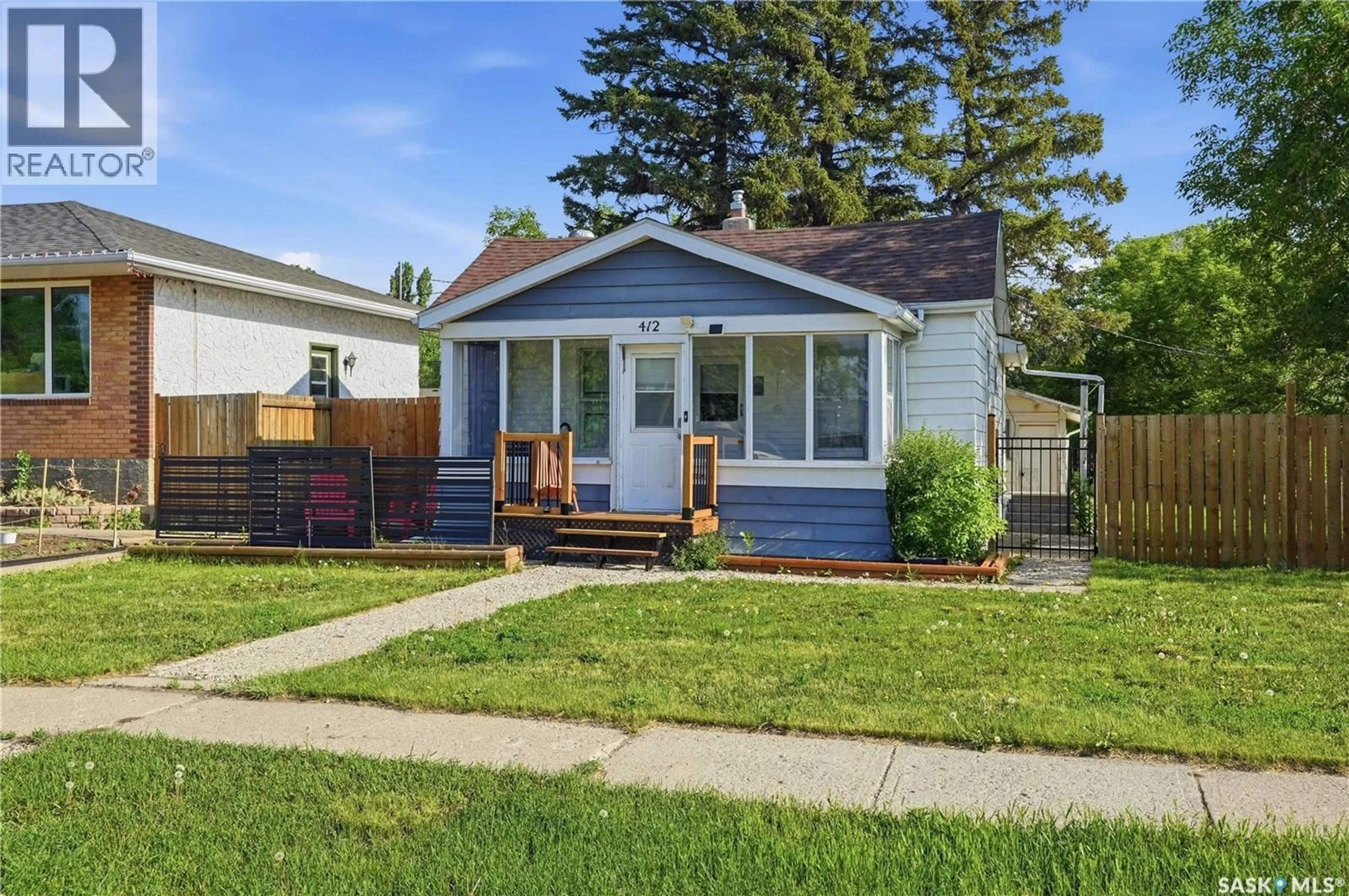 Home with vinyl exterior material, street for 412 VAUGHAN STREET, Moose Jaw Saskatchewan S6H5N2