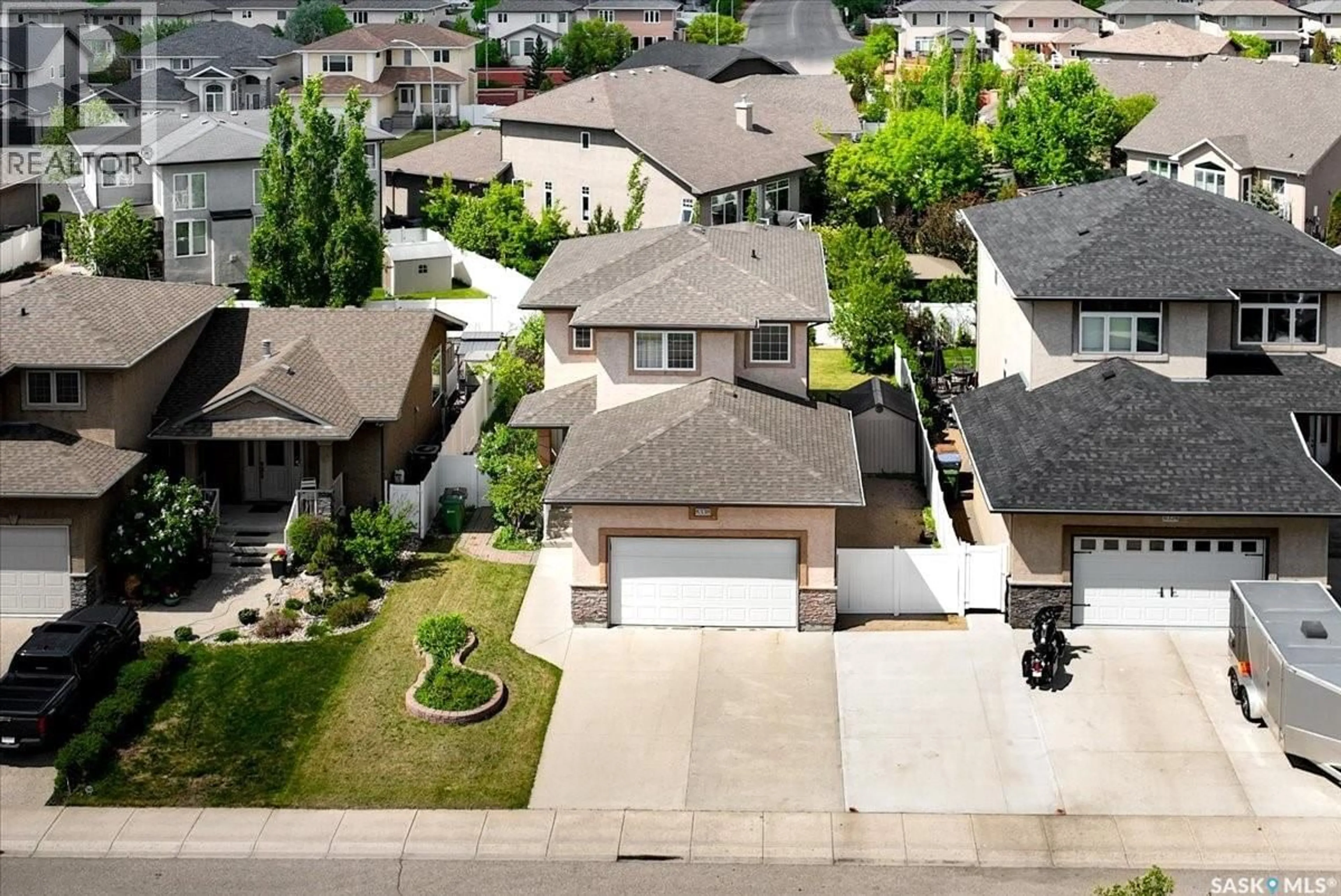A pic from outside/outdoor area/front of a property/back of a property/a pic from drone, street for 8338 WASCANA GARDENS WAY, Regina Saskatchewan S4V1E8