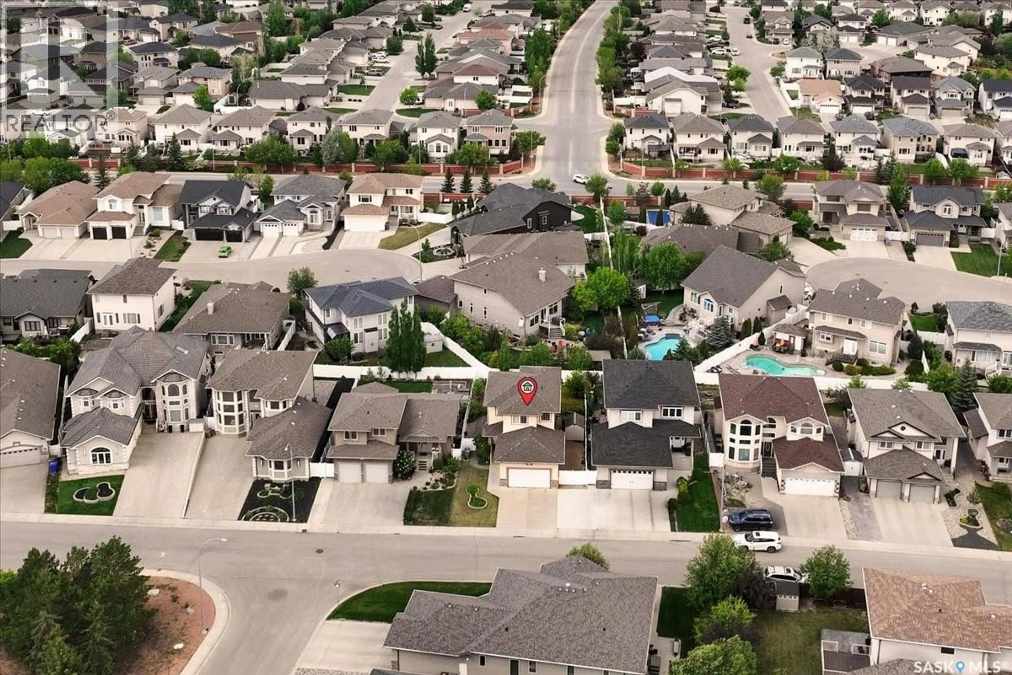 A pic from outside/outdoor area/front of a property/back of a property/a pic from drone, street for 8338 WASCANA GARDENS WAY, Regina Saskatchewan S4V1E8