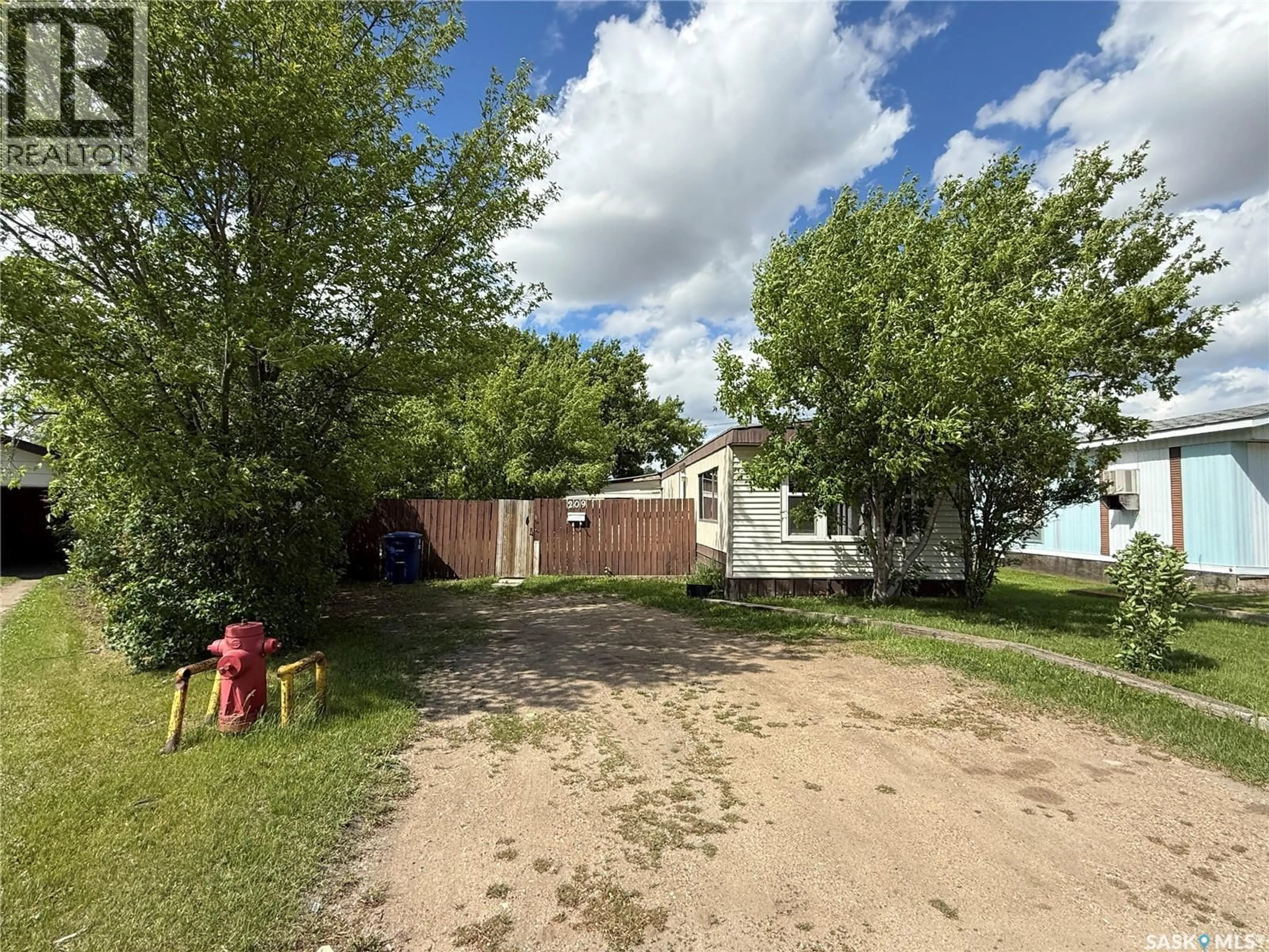 A pic from outside/outdoor area/front of a property/back of a property/a pic from drone, unknown for 209 NELSON PLACE, Warman Saskatchewan S0K4S0