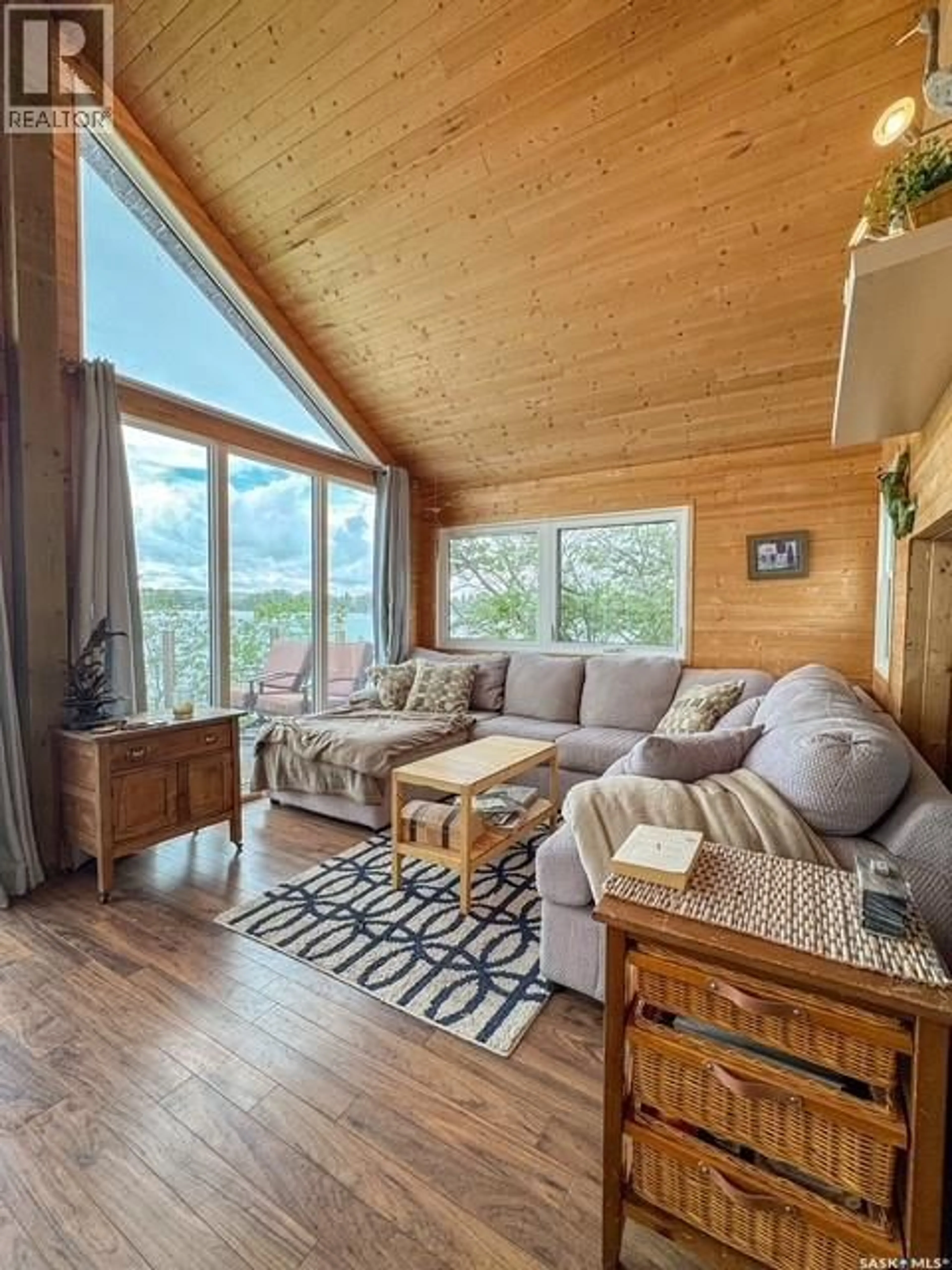 Living room with furniture, wood/laminate floor for 59 CLEARWATER LAKE, Lacadena Rm No. 228 Saskatchewan S0L1T0