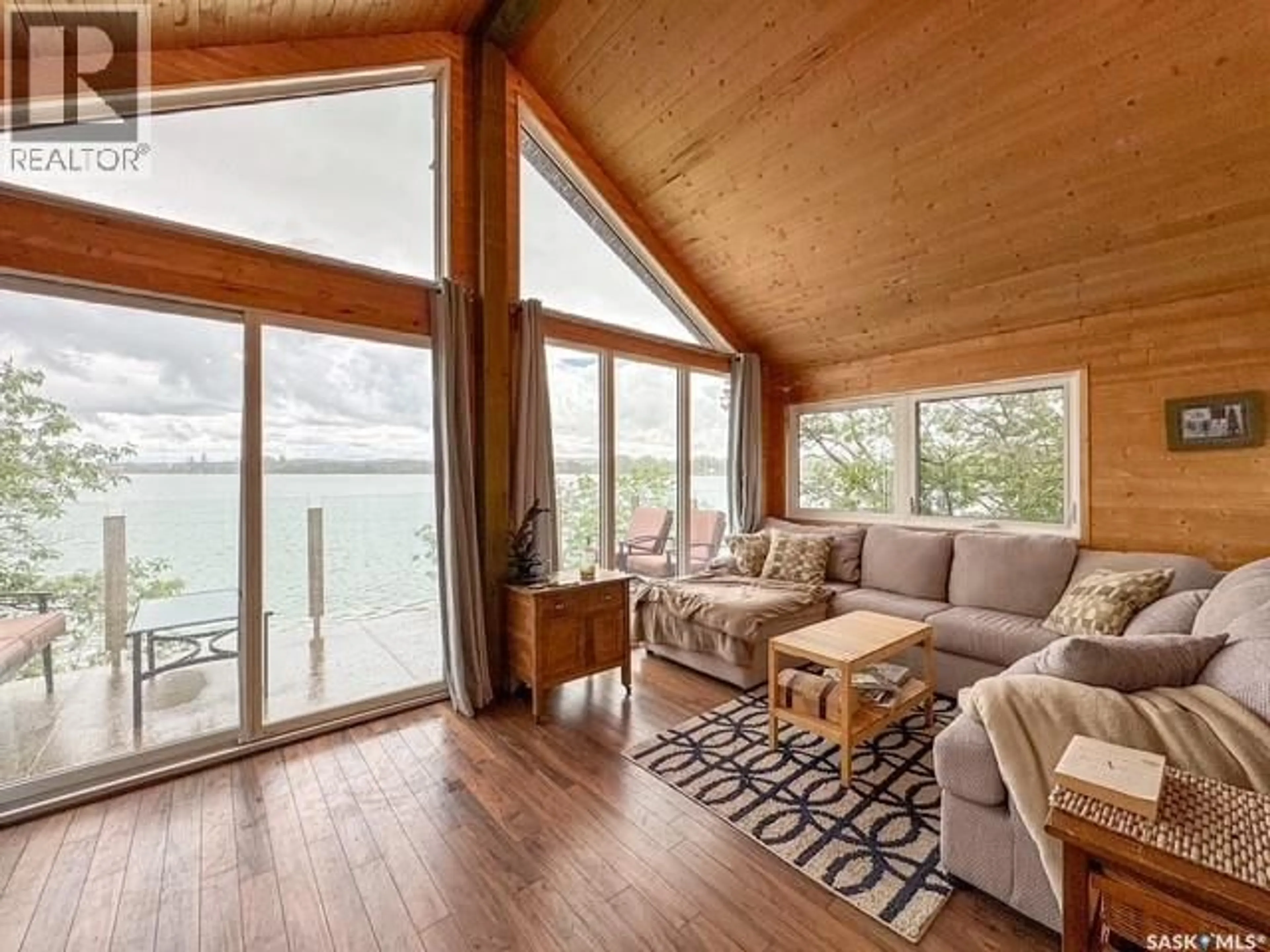 Living room with furniture, wood/laminate floor for 59 CLEARWATER LAKE, Lacadena Rm No. 228 Saskatchewan S0L1T0