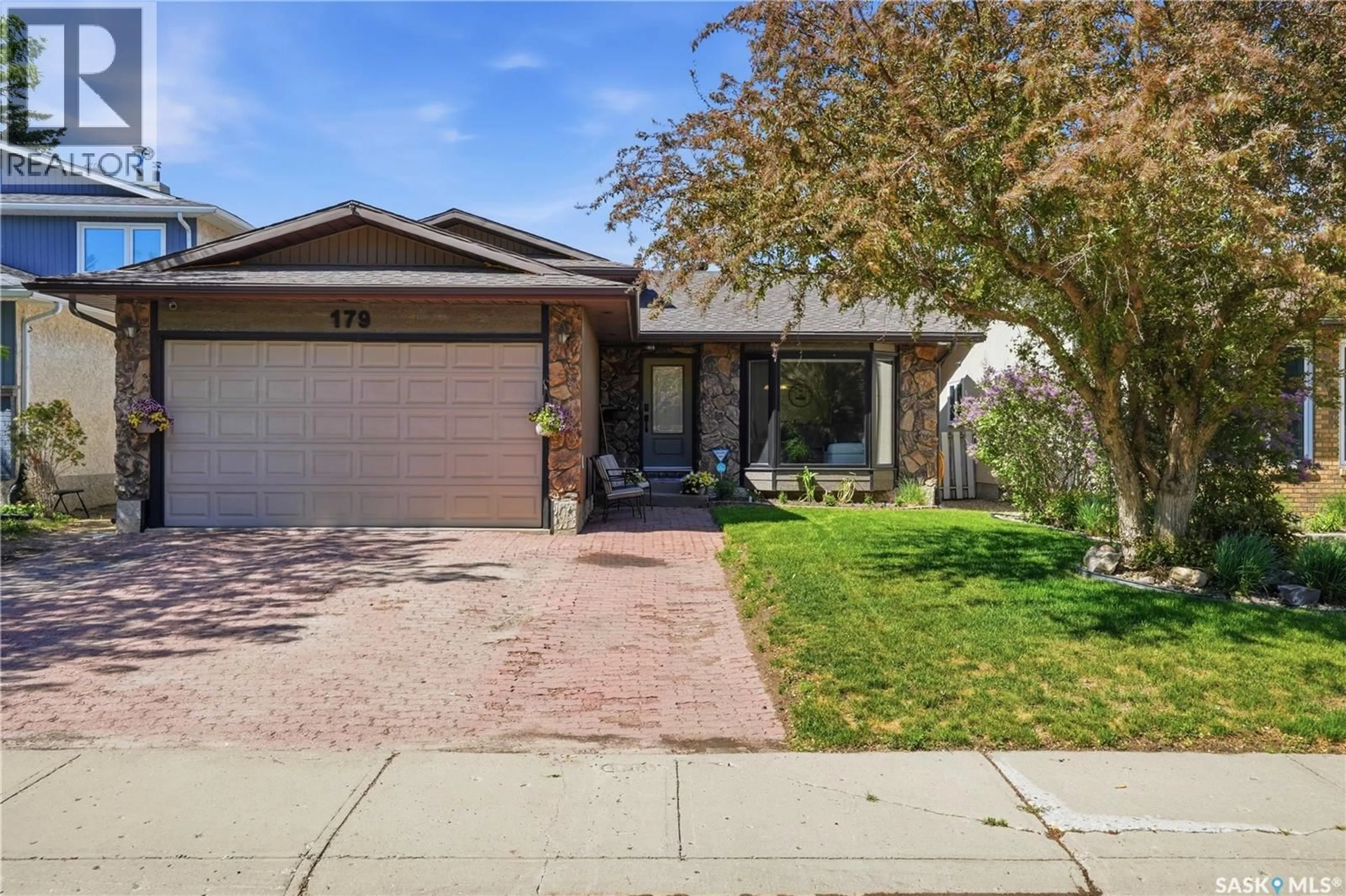 Home with brick exterior material, street for 179 MERLIN CRESCENT, Regina Saskatchewan S4R3E6