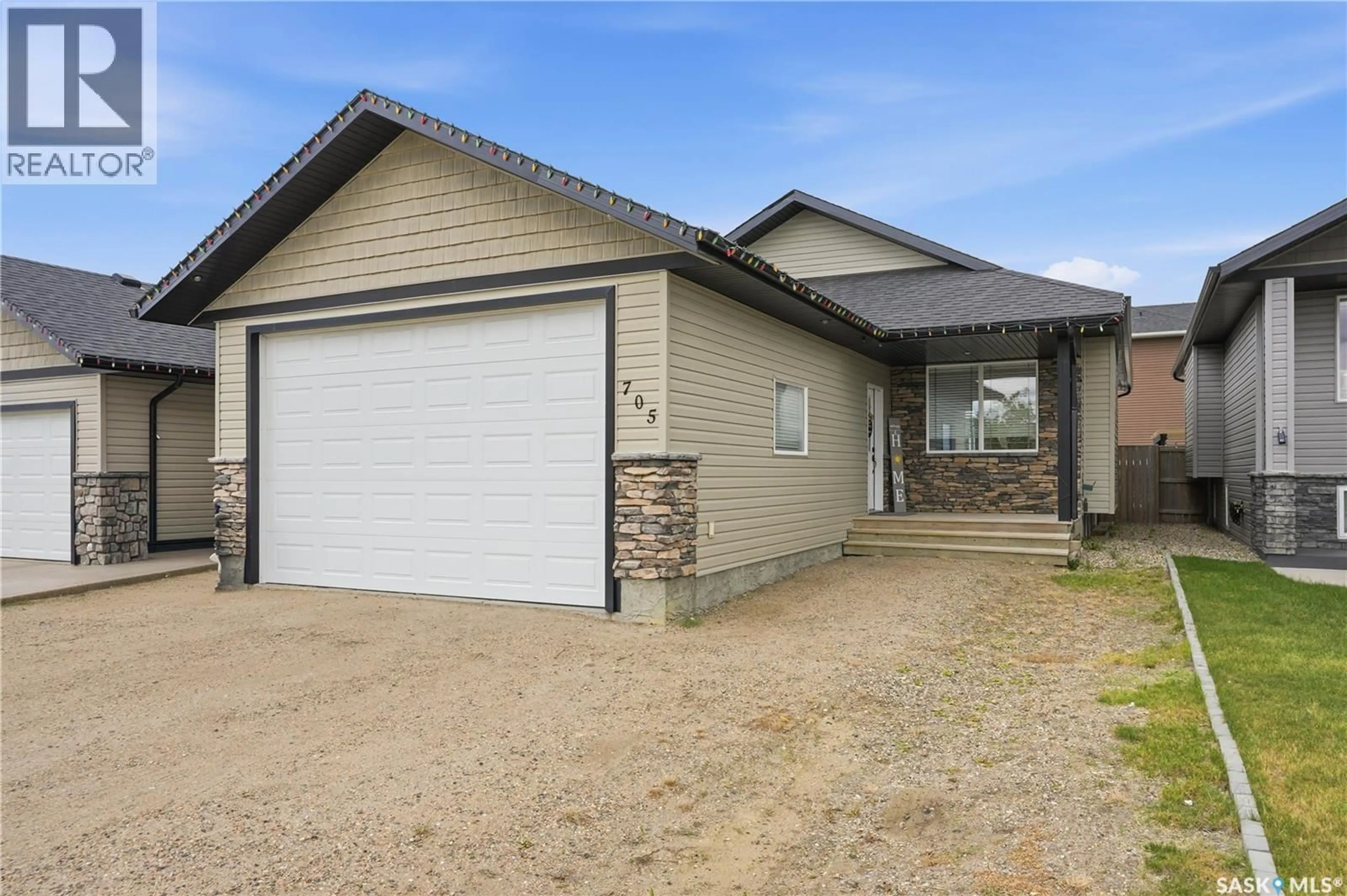 Home with vinyl exterior material, street for 705 GOWAN ROAD, Warman Saskatchewan S0K4S2