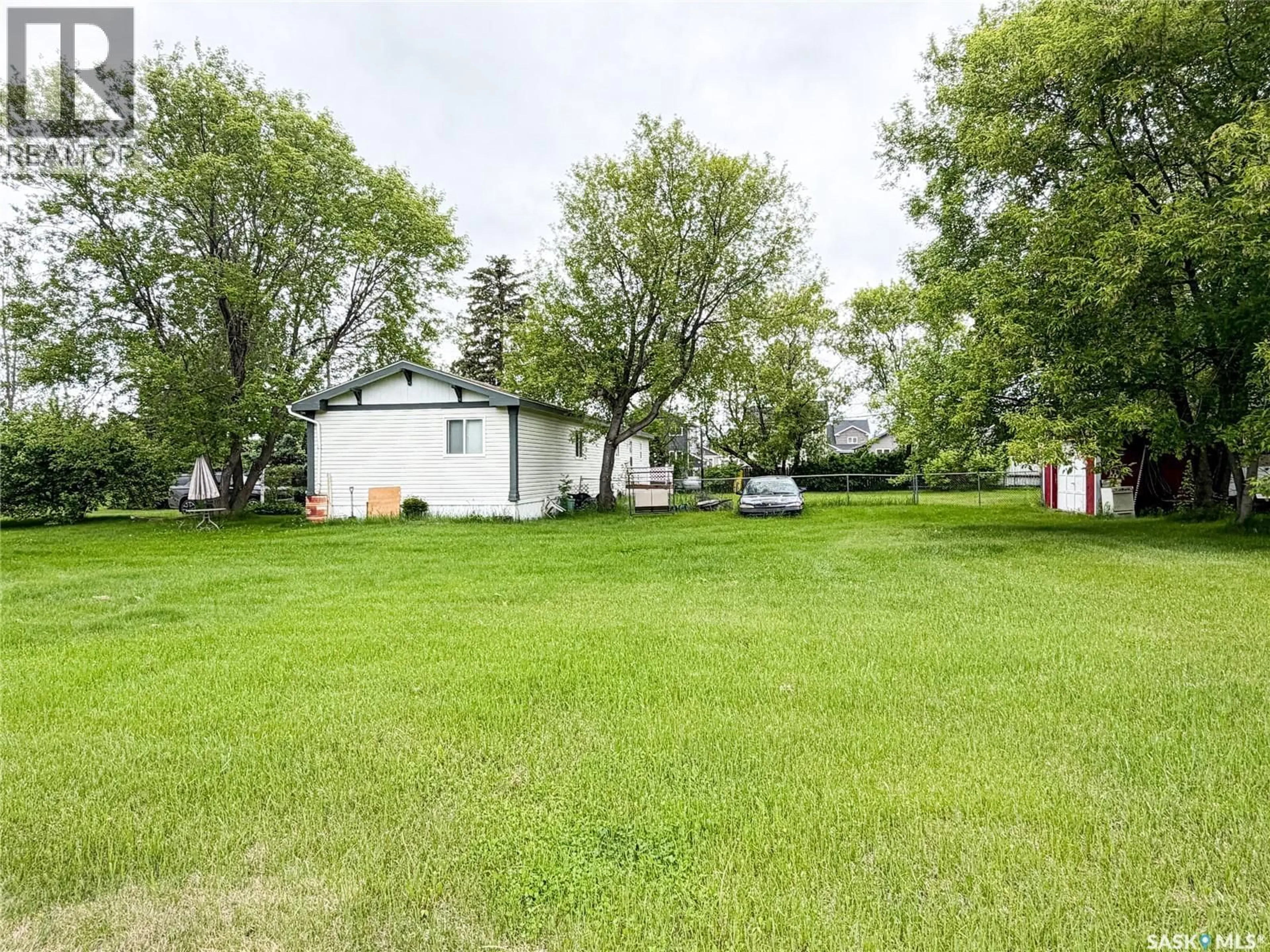 A pic from outside/outdoor area/front of a property/back of a property/a pic from drone, water/lake/river/ocean view for E - 501 7TH AVENUE, Meadow Lake Saskatchewan S9X1X9