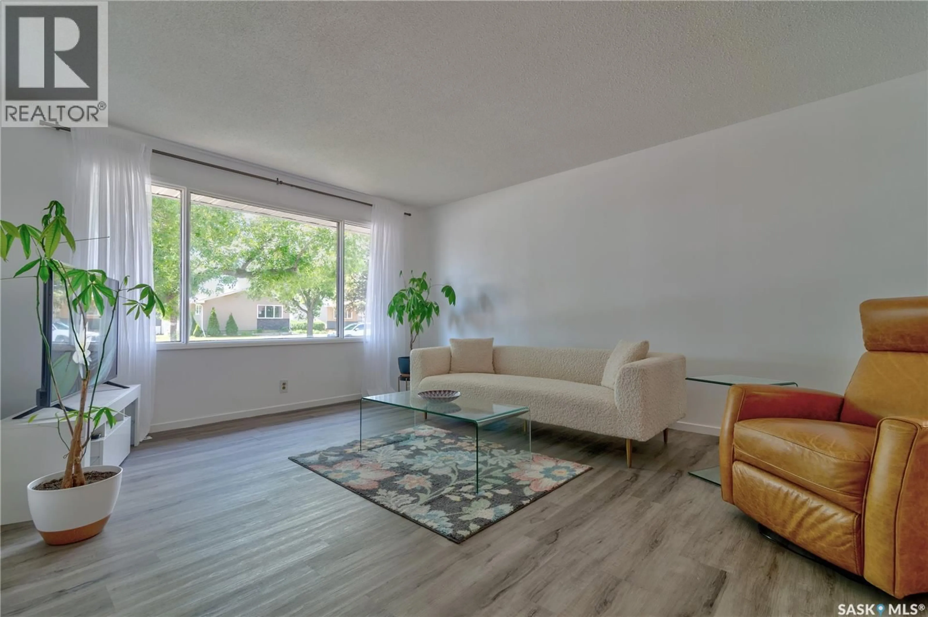 Living room with furniture, wood/laminate floor for 2314 DEWDNEY AVENUE, Regina Saskatchewan S4N4E1