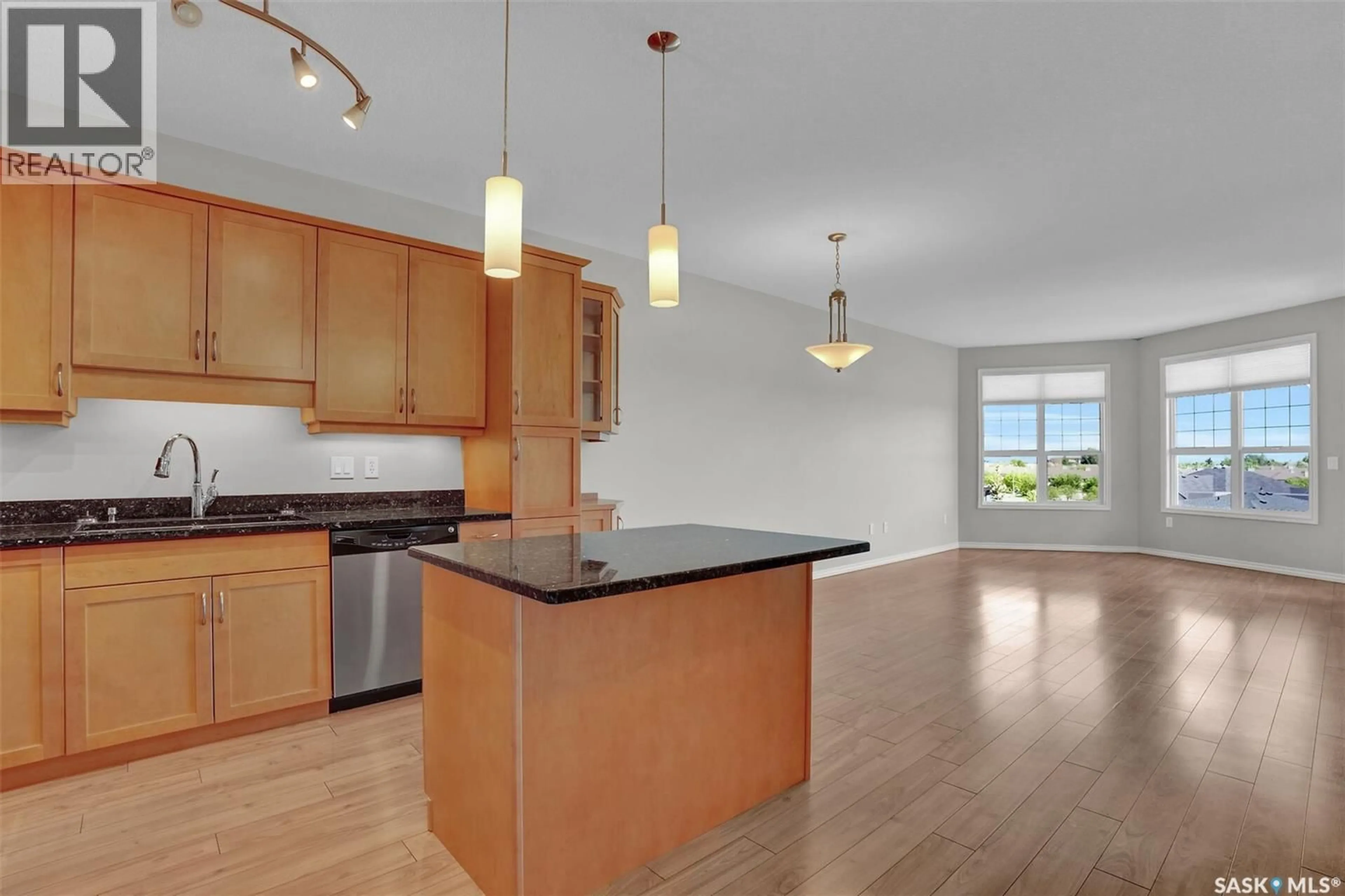 Open concept kitchen, wood/laminate floor for 304 - 2150 HESELTINE ROAD, Regina Saskatchewan S4V1L1