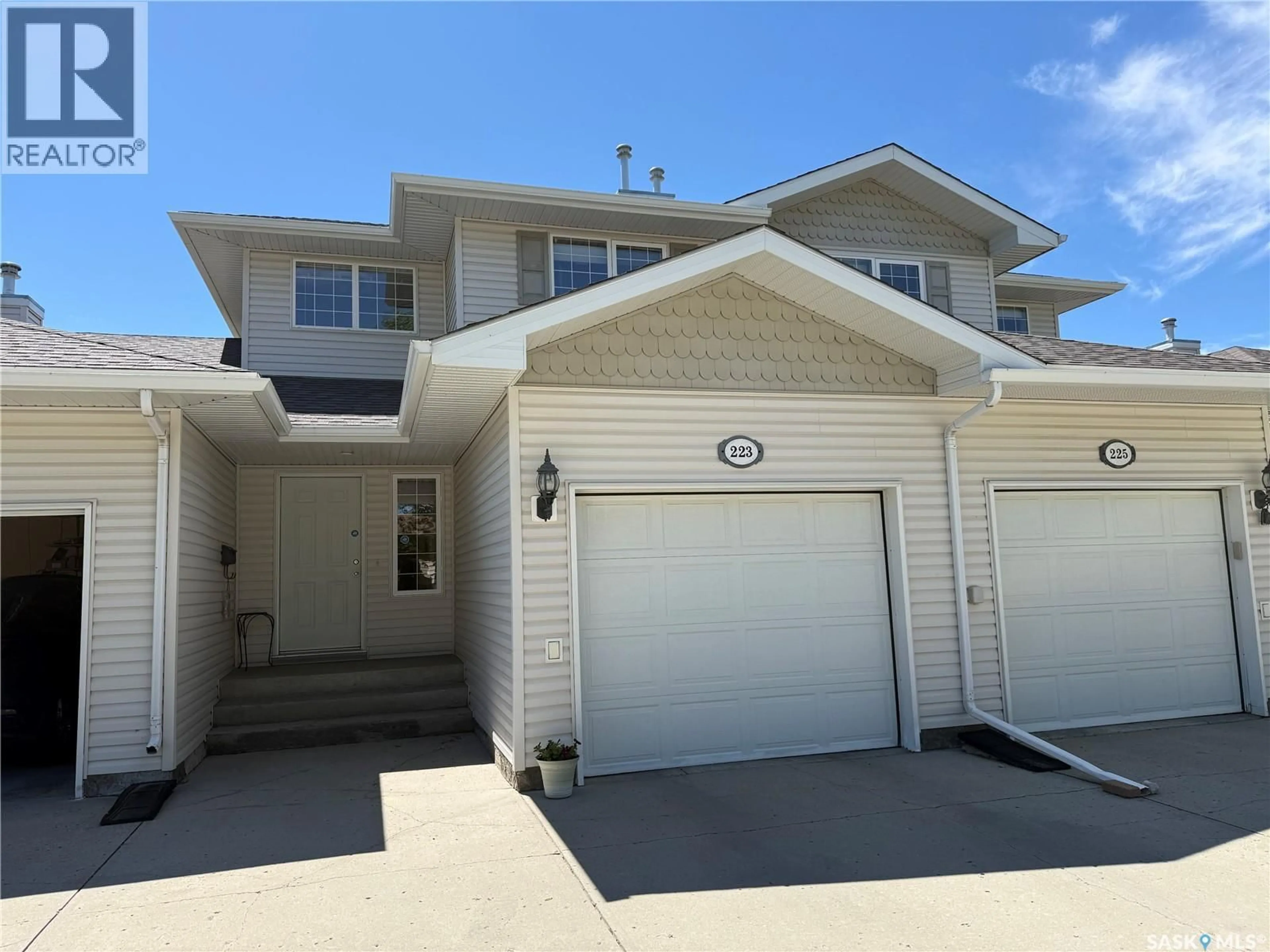Home with vinyl exterior material, street for 223 MIKKELSON DRIVE, Regina Saskatchewan S4T0A3