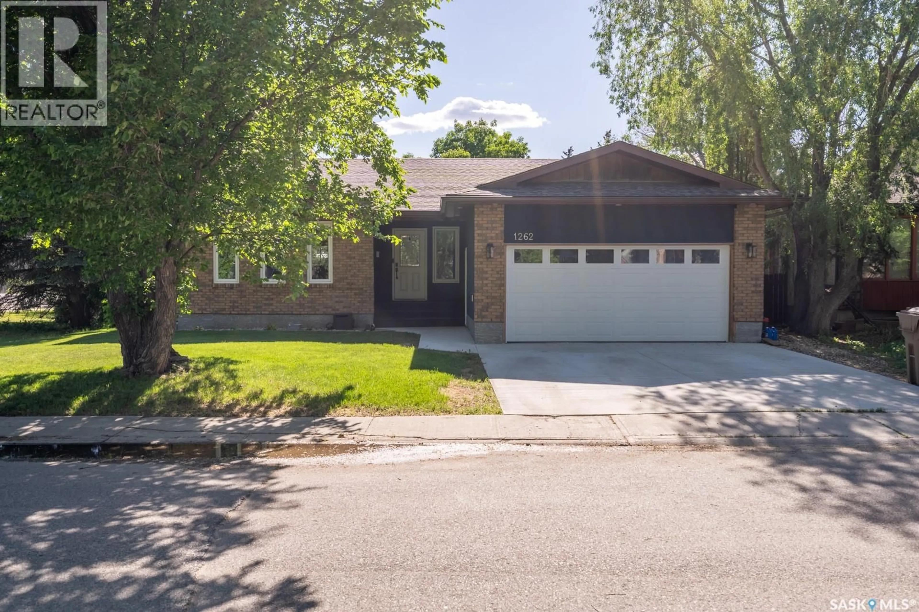 Home with brick exterior material, street for 1262 JAMES CRESCENT, Regina Saskatchewan S4M6A5