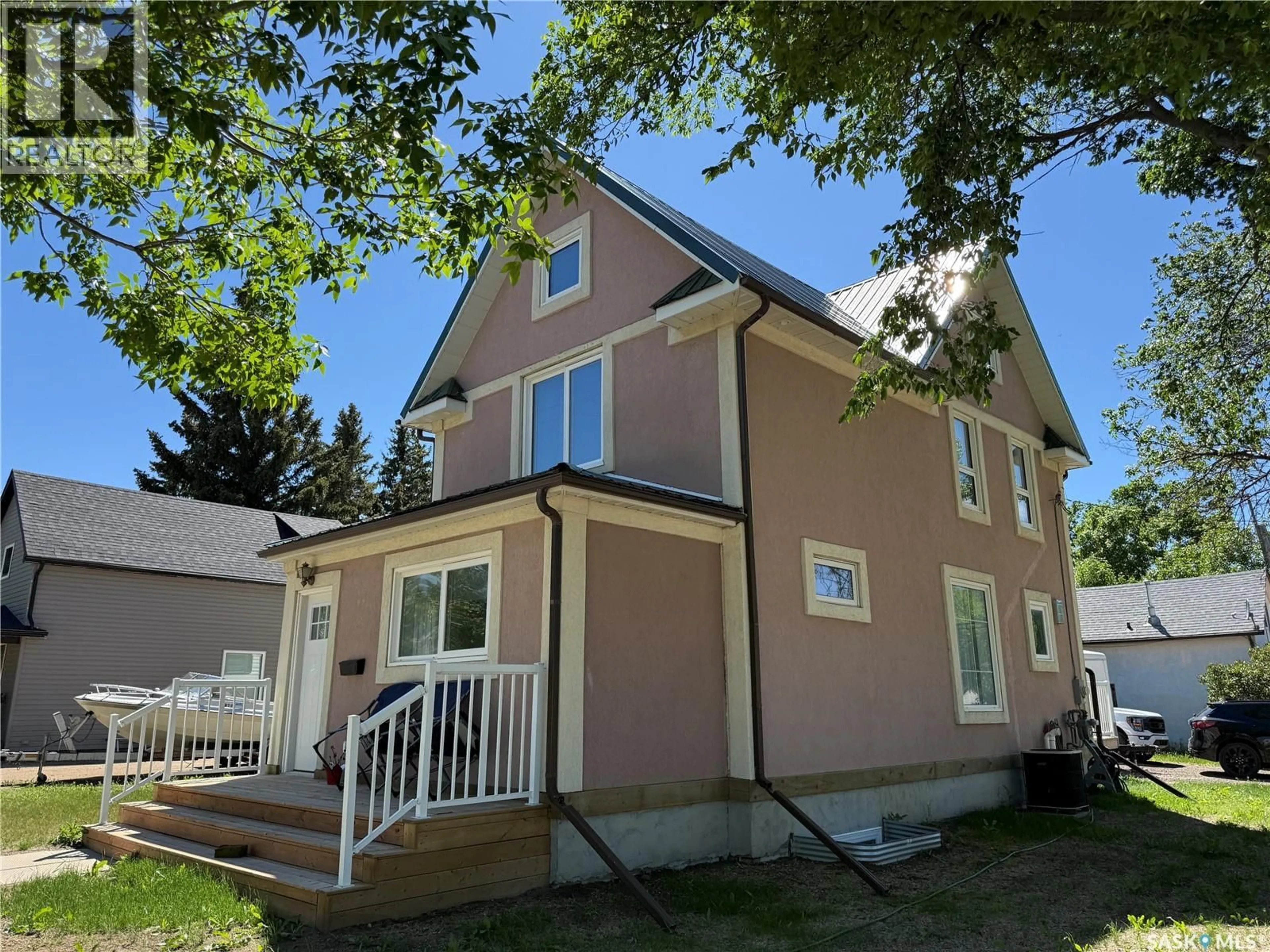 Home with vinyl exterior material, street for 301 3RD STREET, Weyburn Saskatchewan S4H2C5