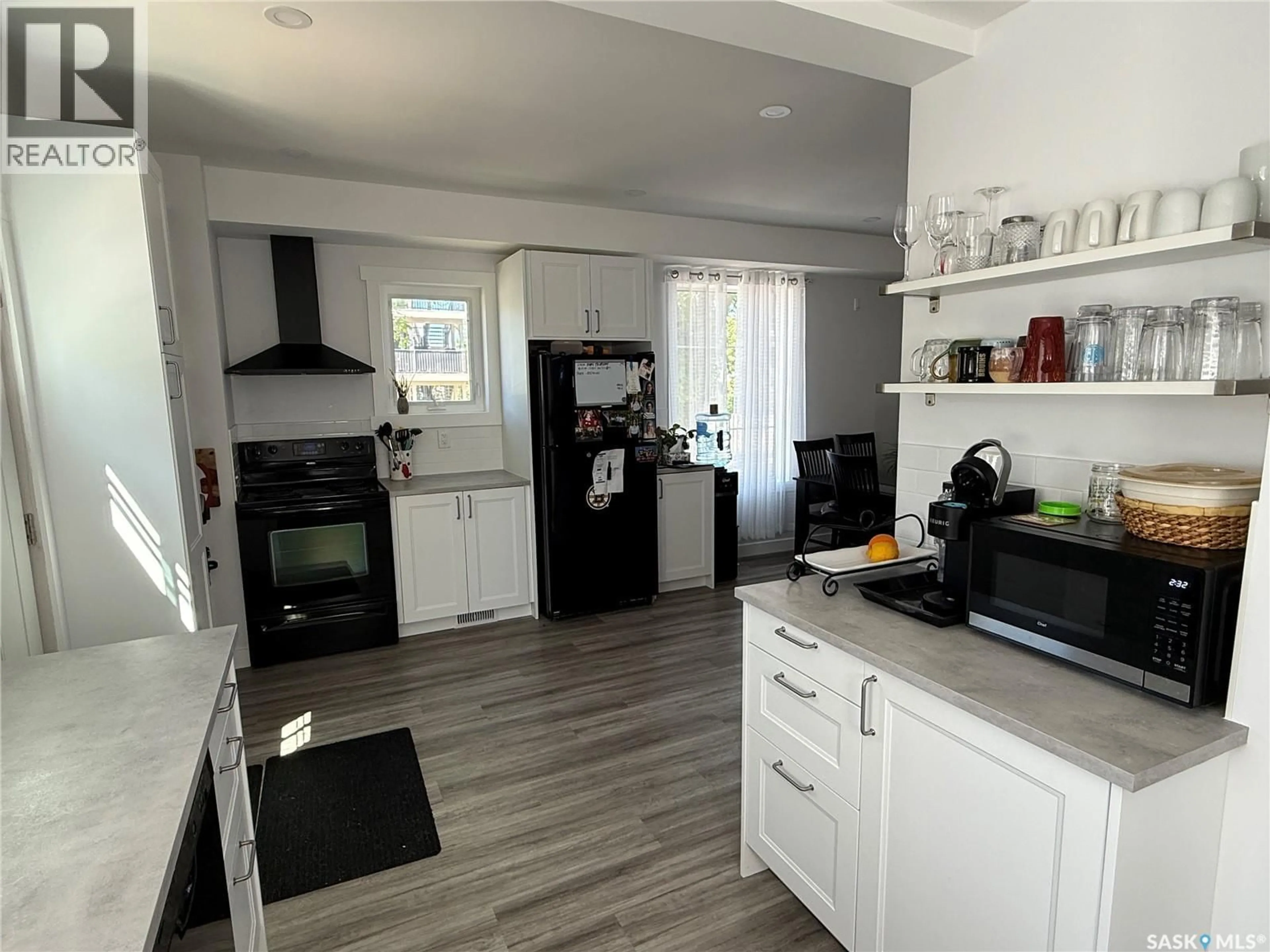 Open concept kitchen, unknown for 301 3RD STREET, Weyburn Saskatchewan S4H2C5