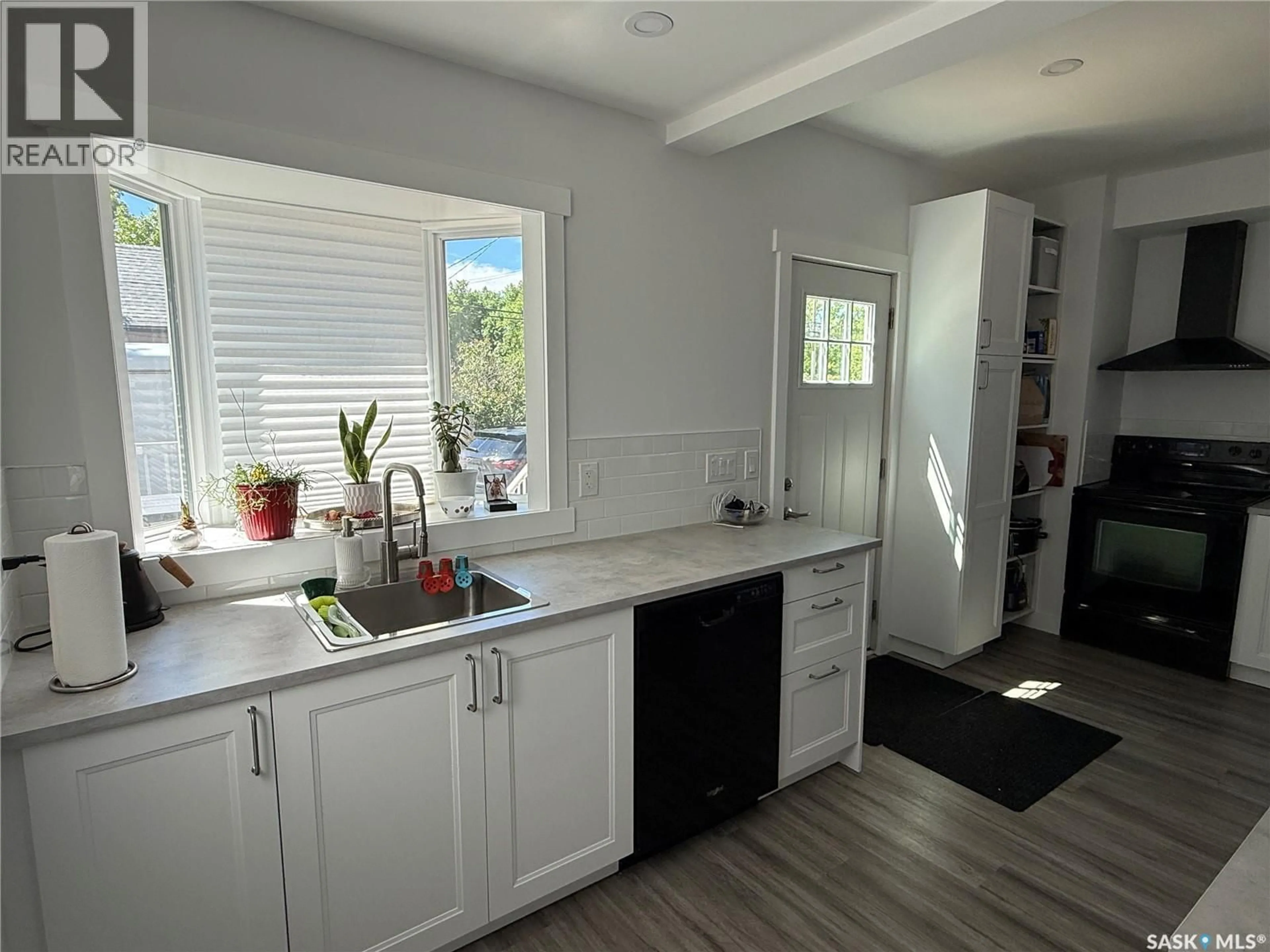 Open concept kitchen, unknown for 301 3RD STREET, Weyburn Saskatchewan S4H2C5