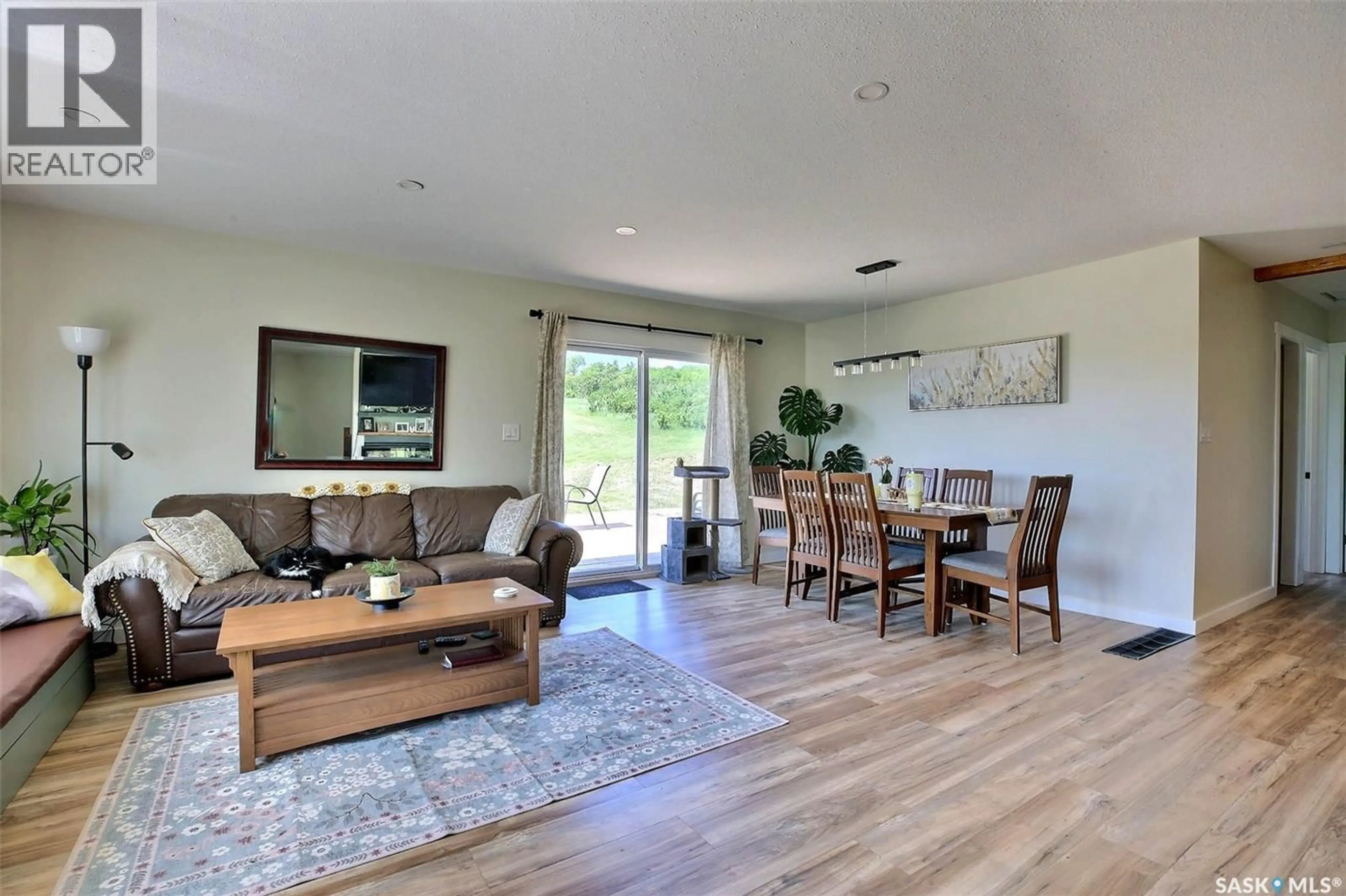 Living room with furniture, wood/laminate floor for MARTENS ACREAGE, Lumsden Rm No. 189 Saskatchewan S0G3C0