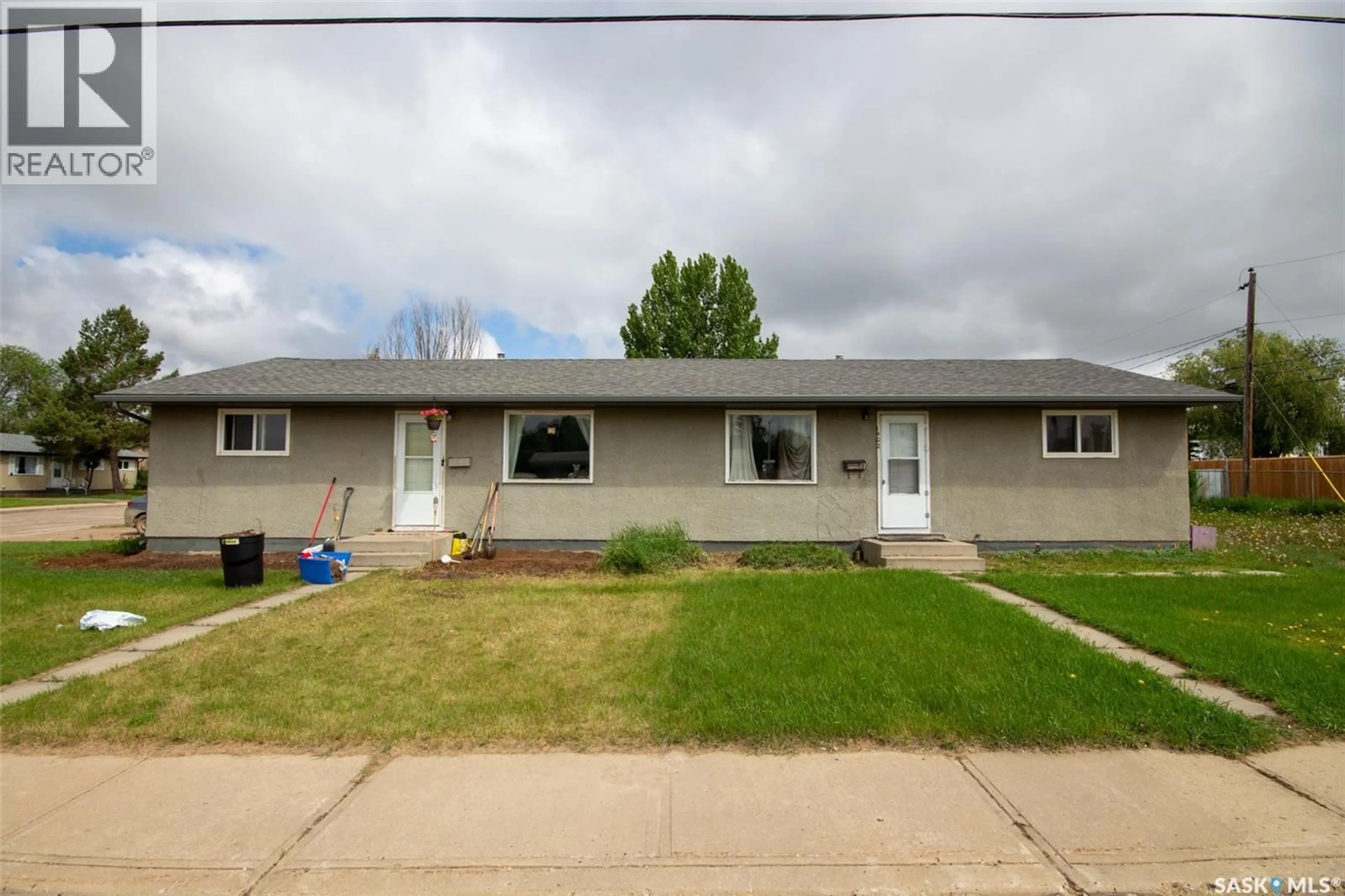 Home with vinyl exterior material, street for 1402 112TH STREET, North Battleford Saskatchewan S9A3B2