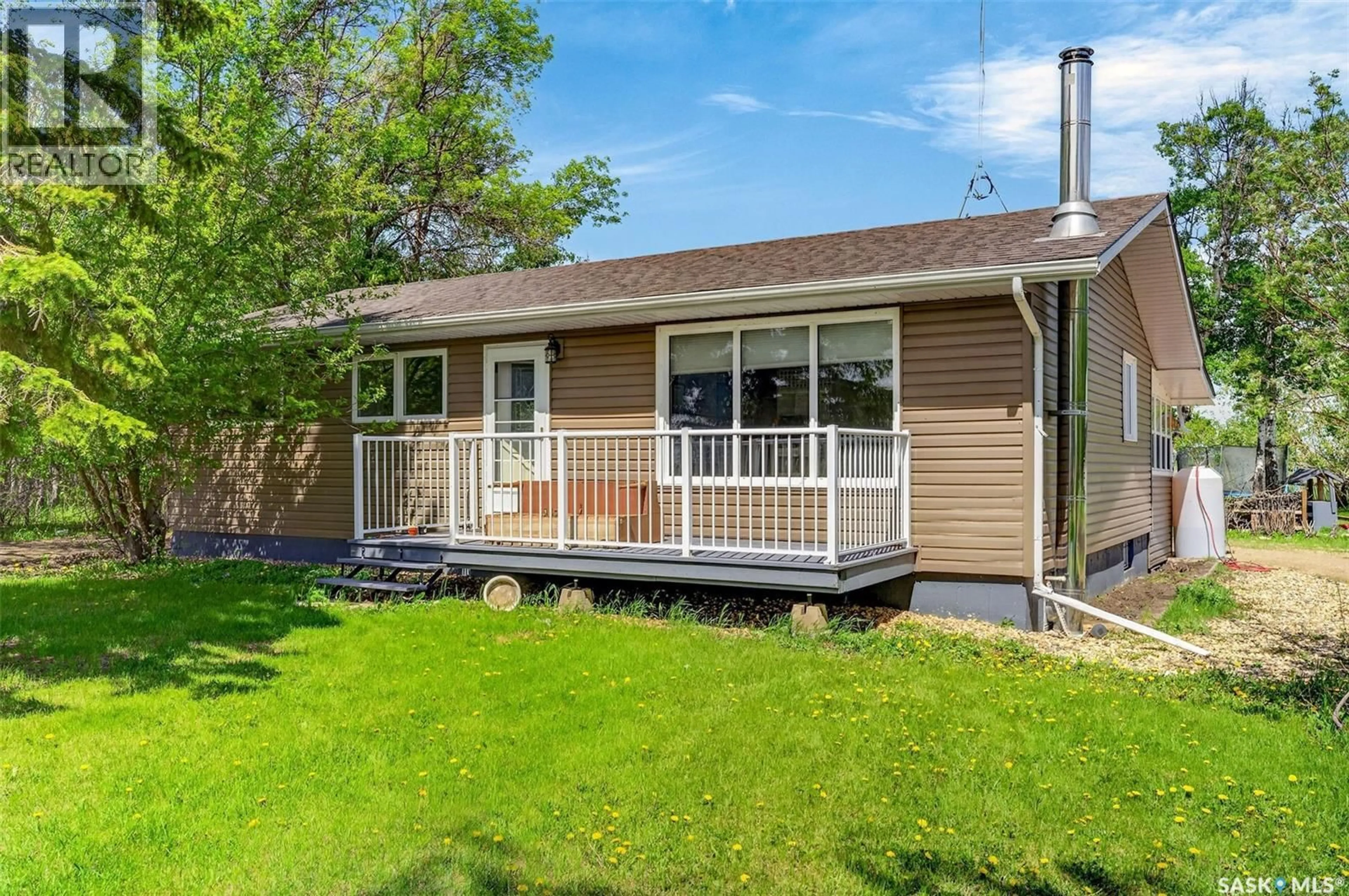 Home with vinyl exterior material, street for St BRIEUX ACREAGE, Fletts Springs Rm No. 429 Saskatchewan S0K3V0