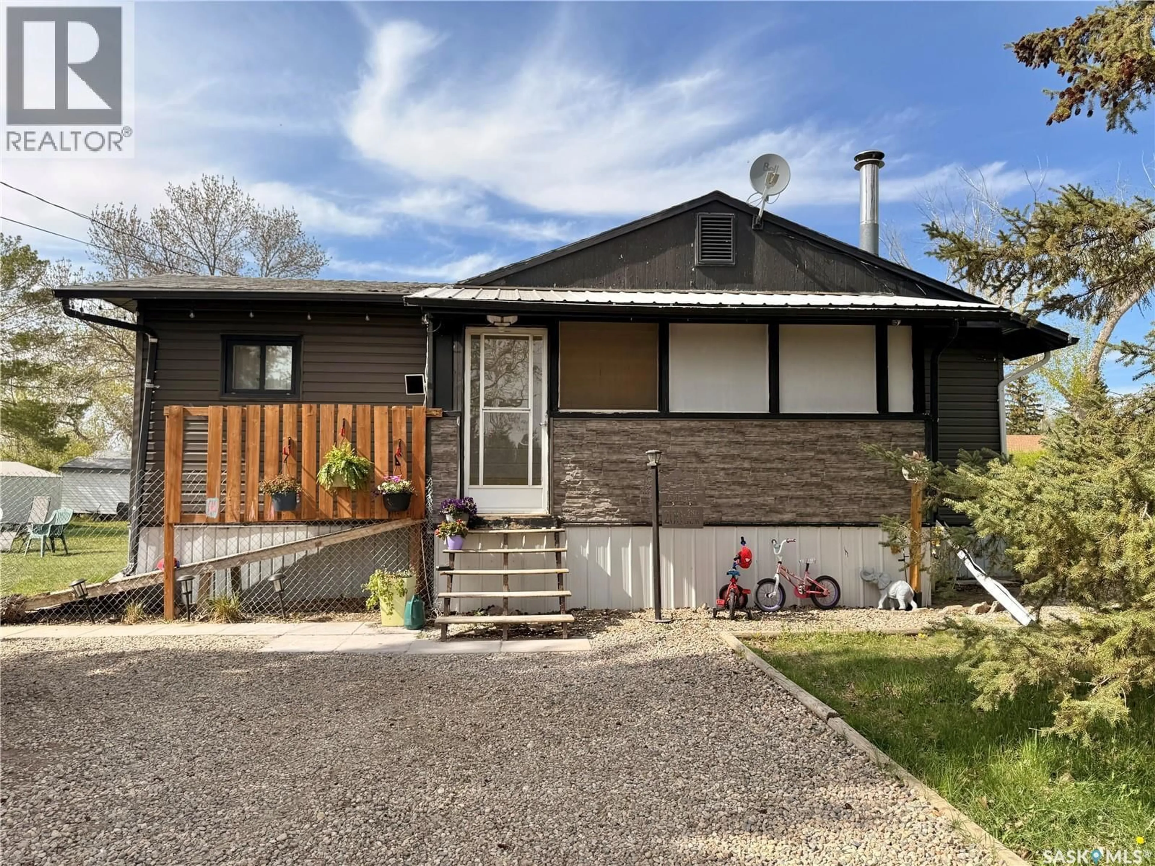 Home with brick exterior material, street for 200 2ND STREET, Dinsmore Saskatchewan S0L0T0