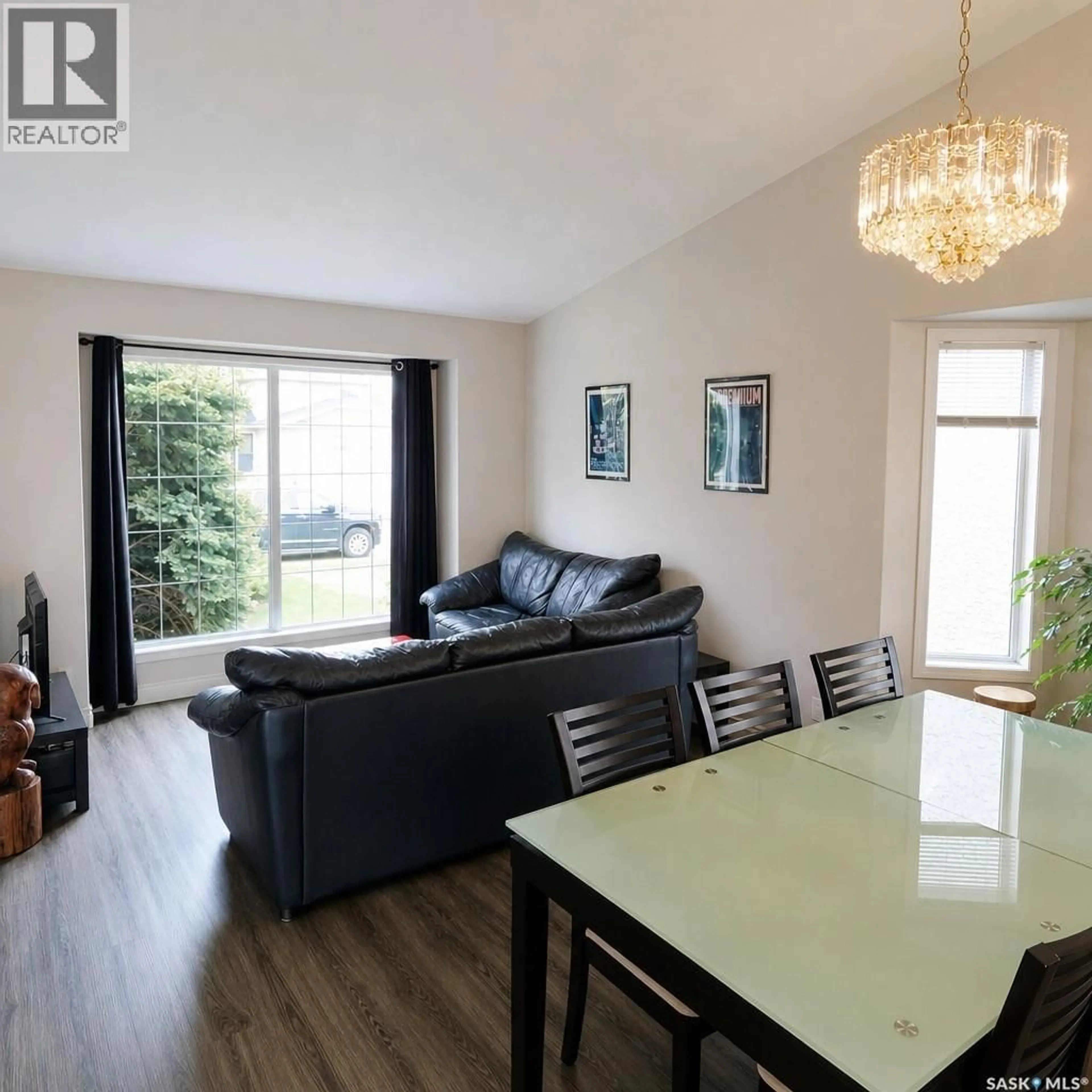 Living room with furniture, wood/laminate floor for 138 LAVALEE PLACE, Saskatoon Saskatchewan S7J5K7