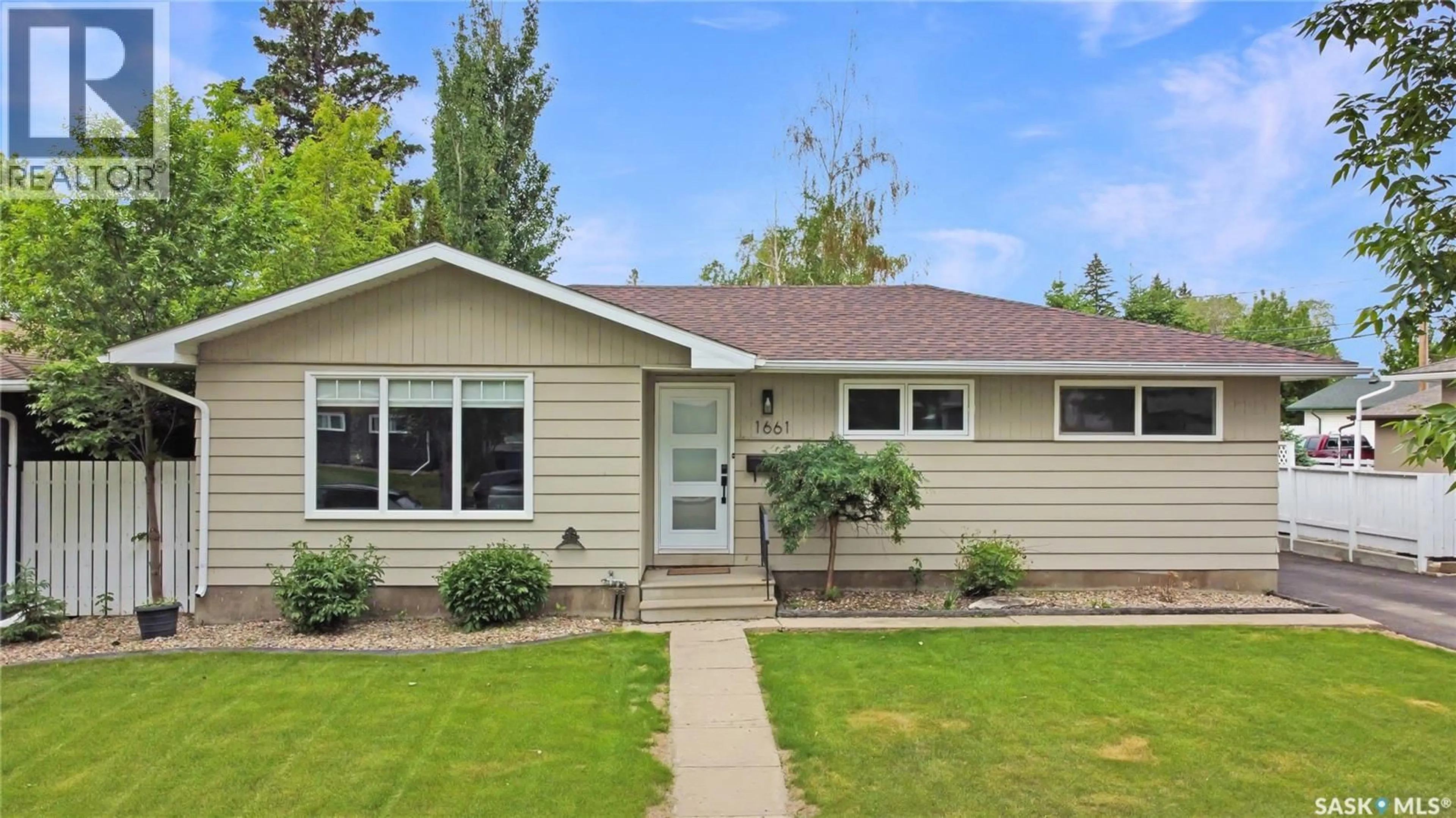 Home with vinyl exterior material, street for 1661 91ST STREET, North Battleford Saskatchewan S9A0A3