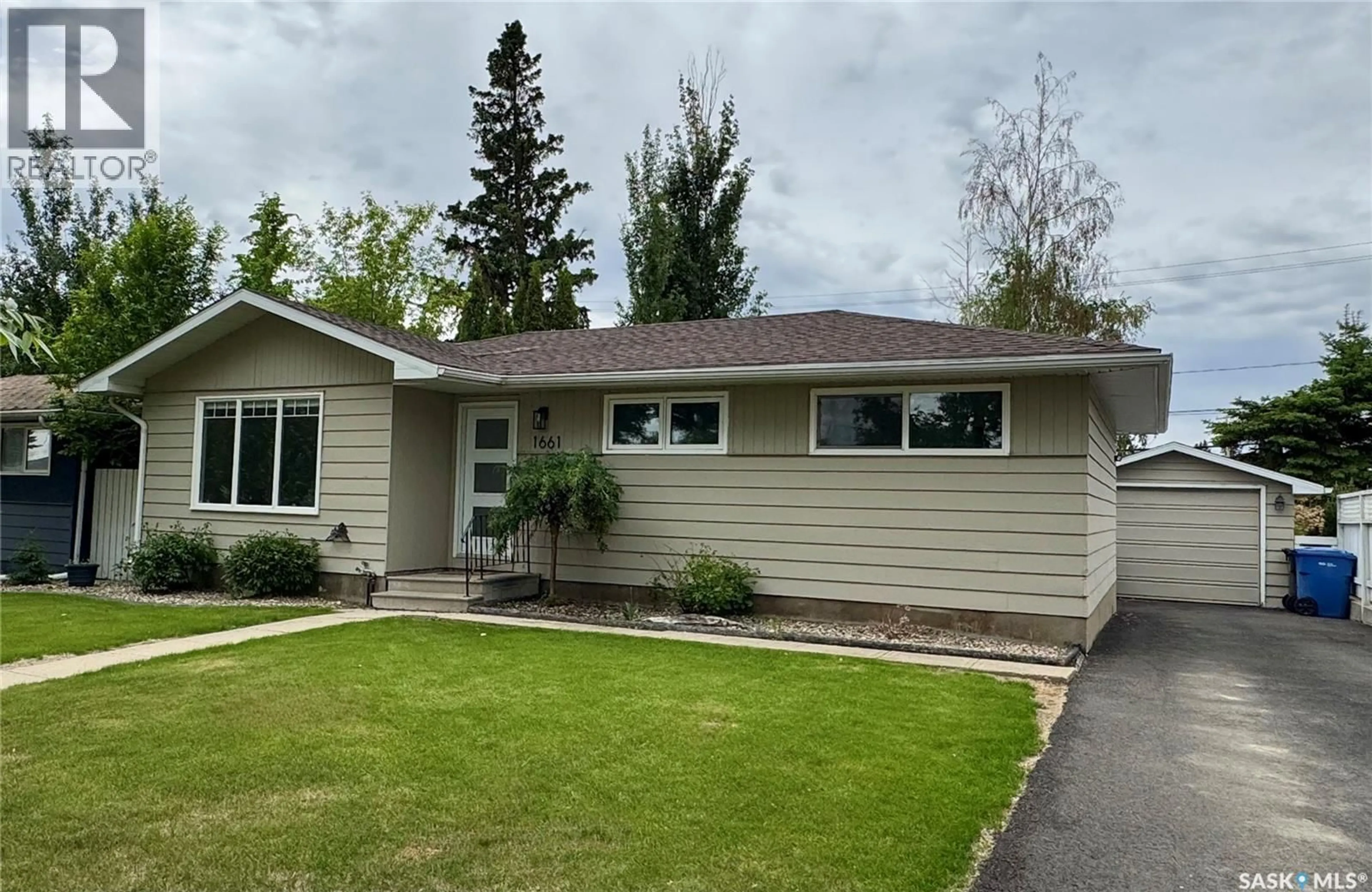Home with vinyl exterior material, street for 1661 91ST STREET, North Battleford Saskatchewan S9A0A3