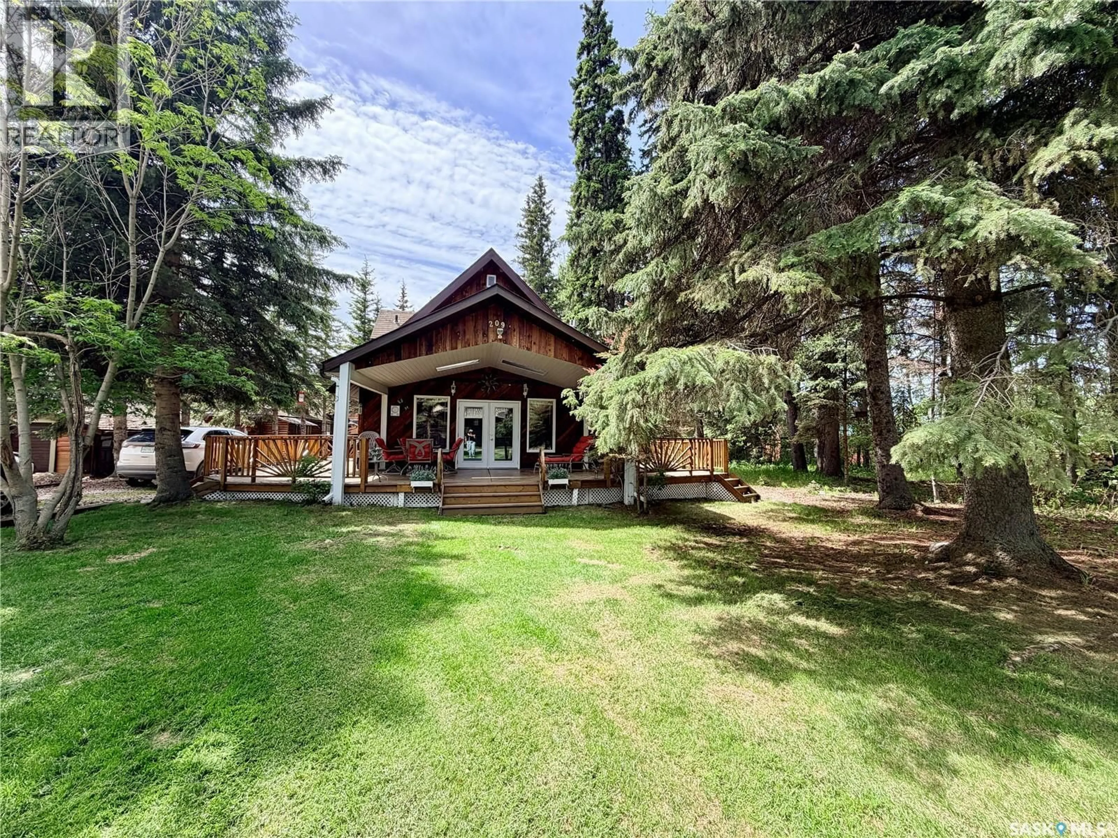 A pic from outside/outdoor area/front of a property/back of a property/a pic from drone, mountain view for 209 AL DRIVE, Turtle View Saskatchewan S0M1Y0
