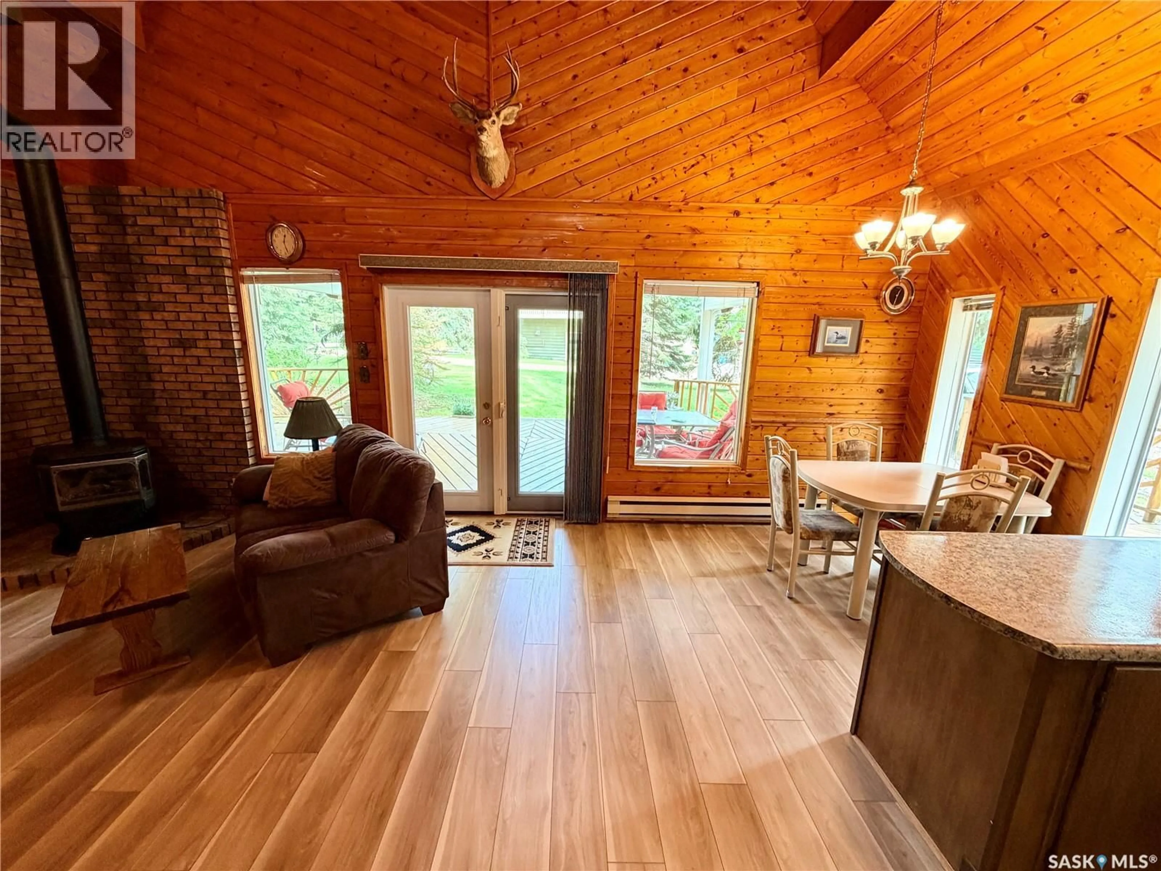 Living room with furniture, wood/laminate floor for 209 AL DRIVE, Turtle View Saskatchewan S0M1Y0