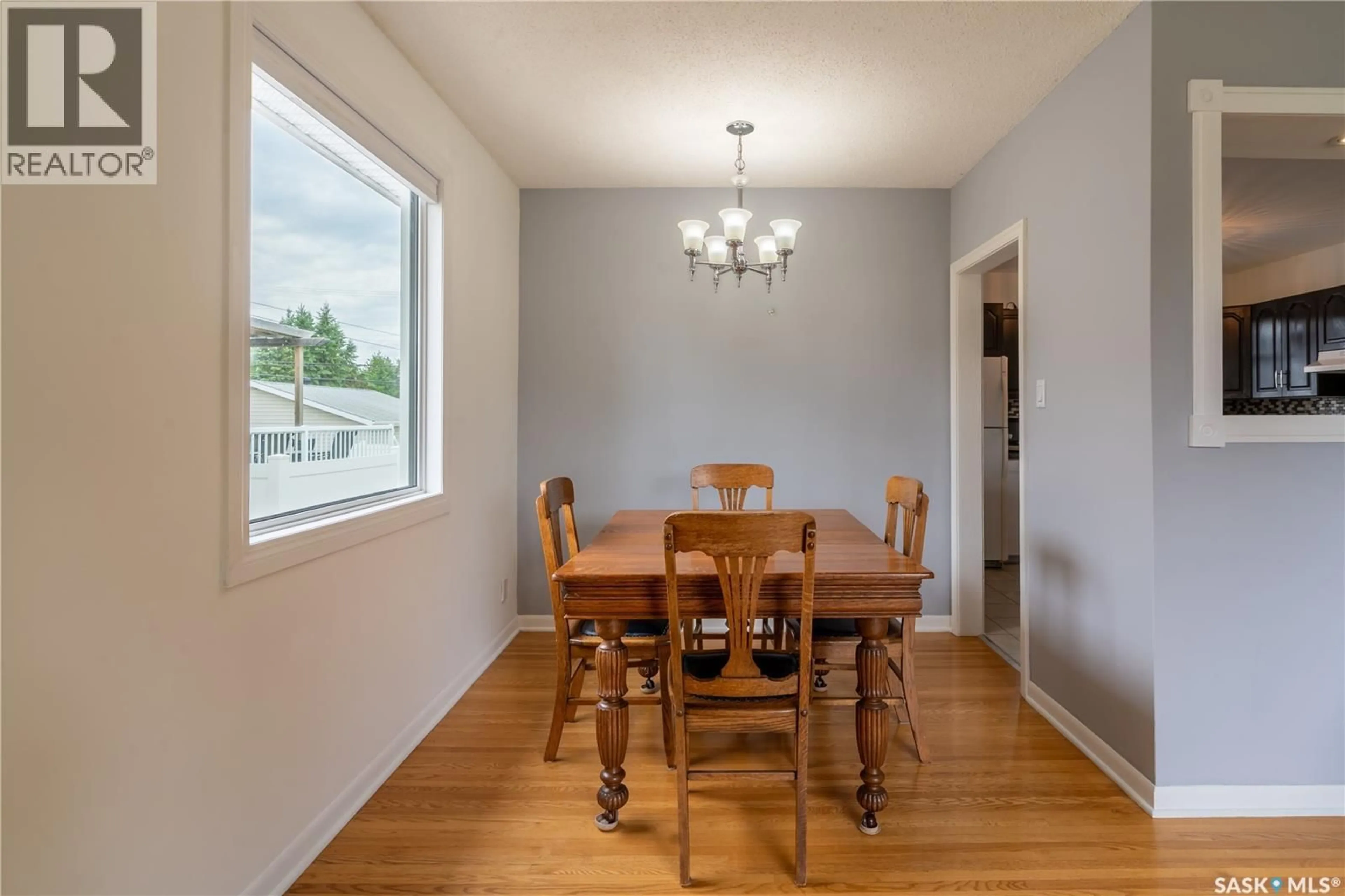 Dining room, wood/laminate floor for 2112 YORK AVENUE, Saskatoon Saskatchewan S7J1H8
