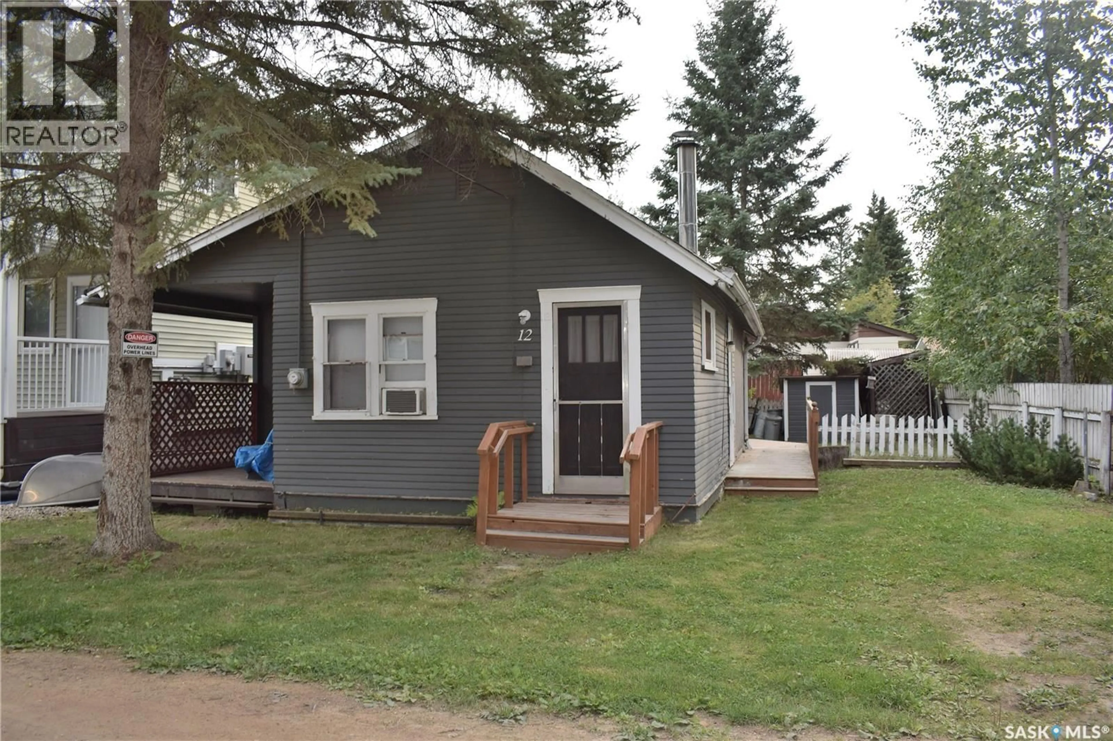 Home with vinyl exterior material, street for 12 6TH STREET, Lakeland Rm No. 521 Saskatchewan S0J0N0