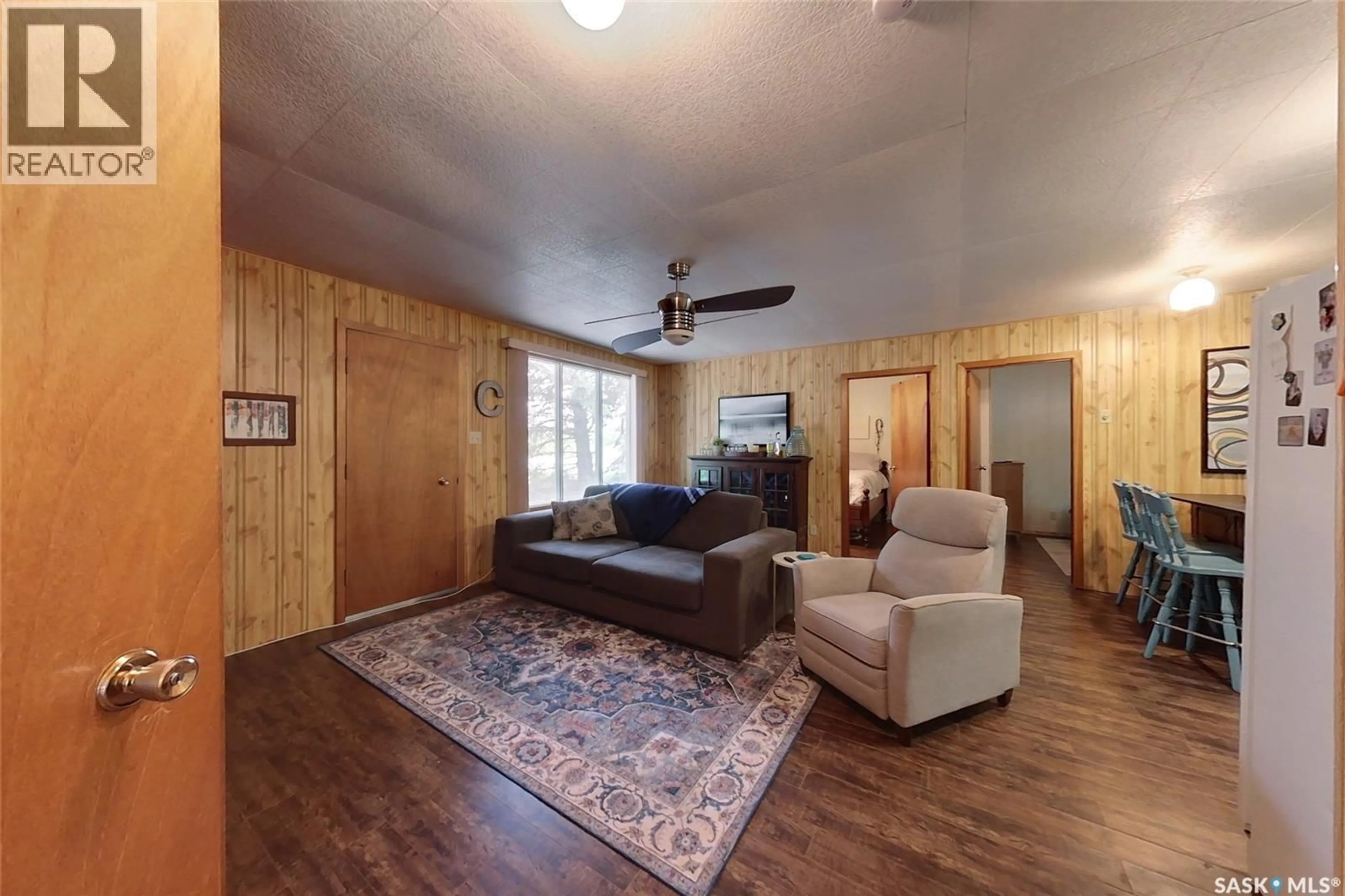 Living room with furniture, wood/laminate floor for 155 LAKESHORE CRESCENT, Mckillop Rm No. 220 Saskatchewan S0G1C0