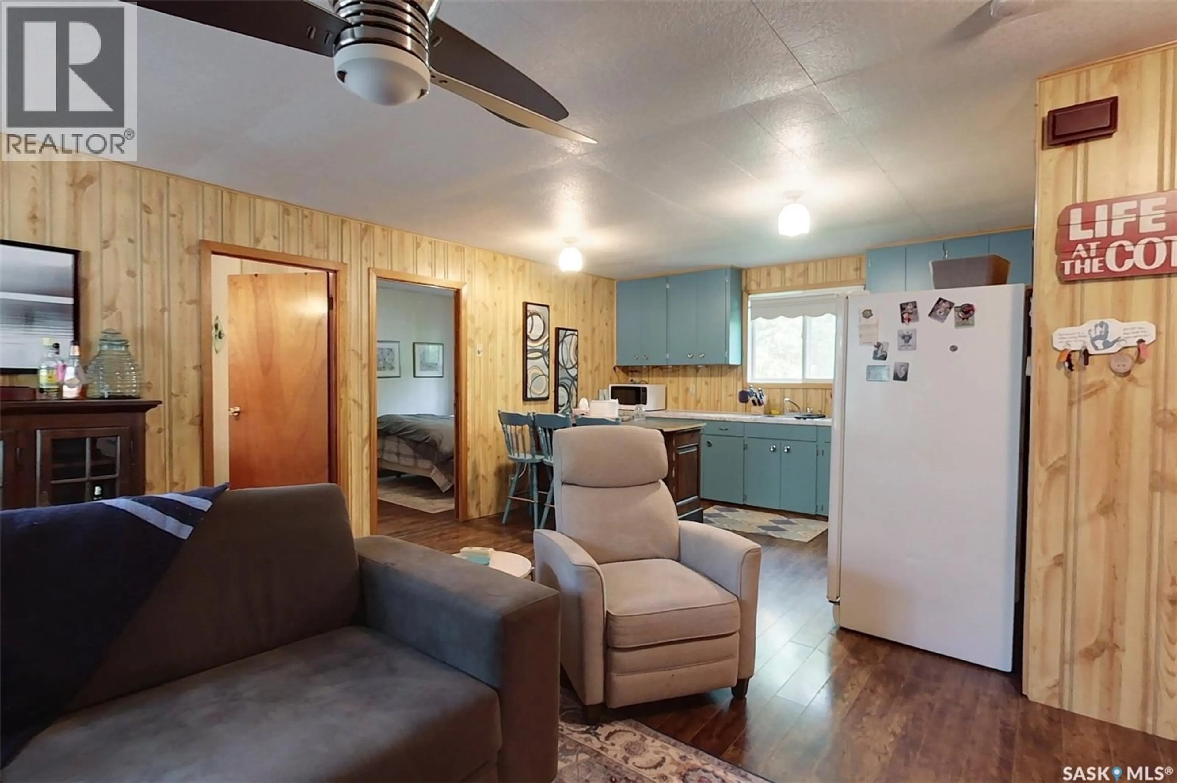 Living room with furniture, wood/laminate floor for 155 LAKESHORE CRESCENT, Mckillop Rm No. 220 Saskatchewan S0G1C0