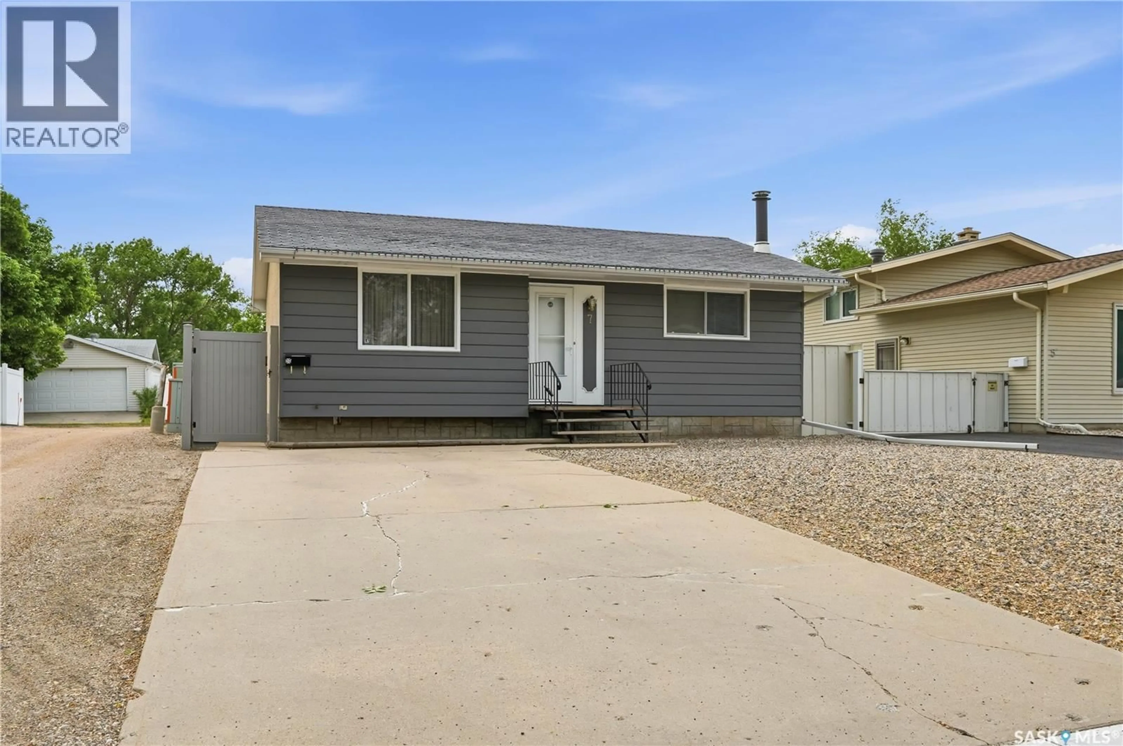Home with vinyl exterior material, street for 7 UPLAND DRIVE, Regina Saskatchewan S4R0B8