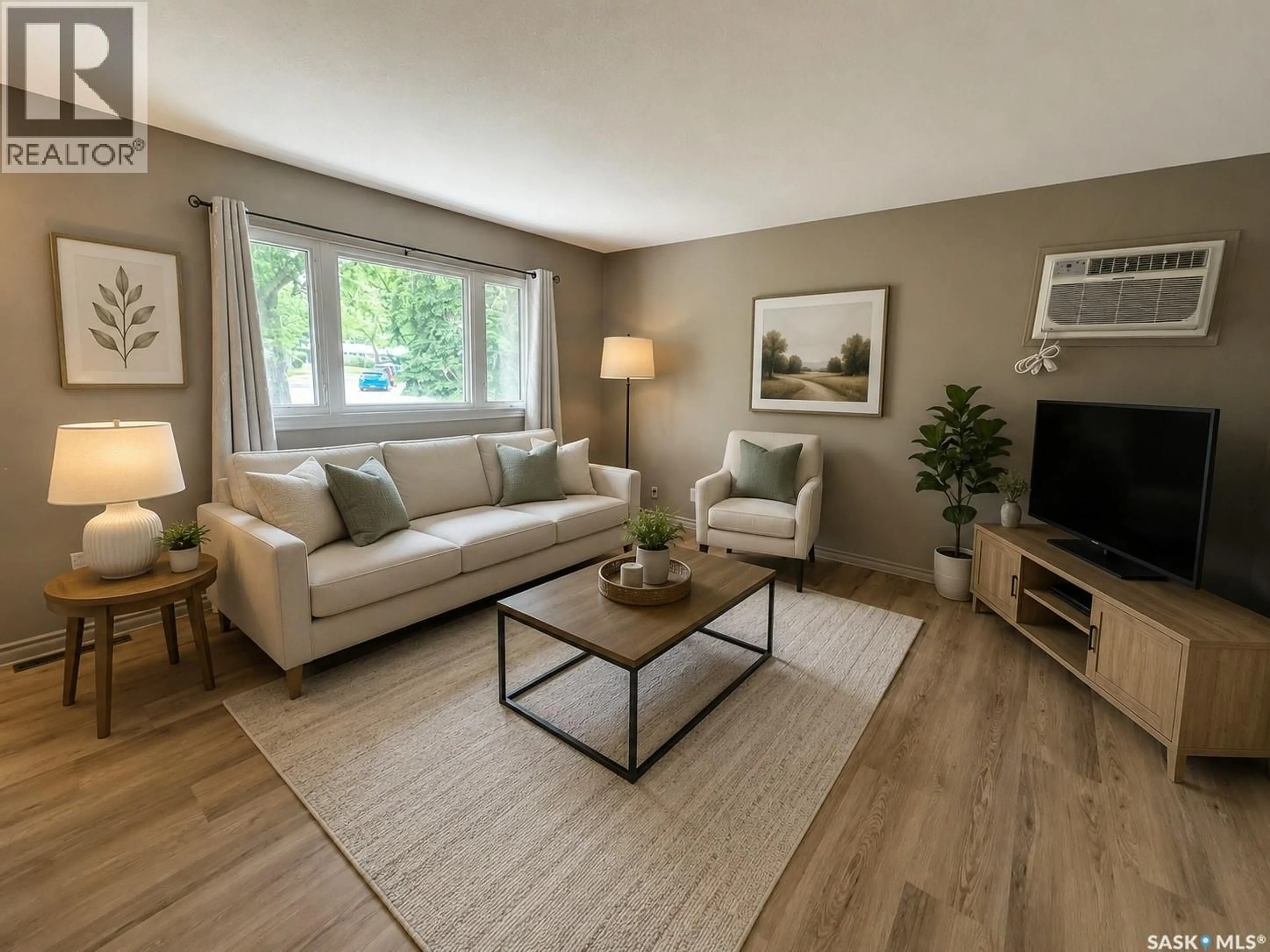 Living room with furniture, wood/laminate floor for 622 WILLIAMS CRESCENT, Regina Saskatchewan S4T6B2