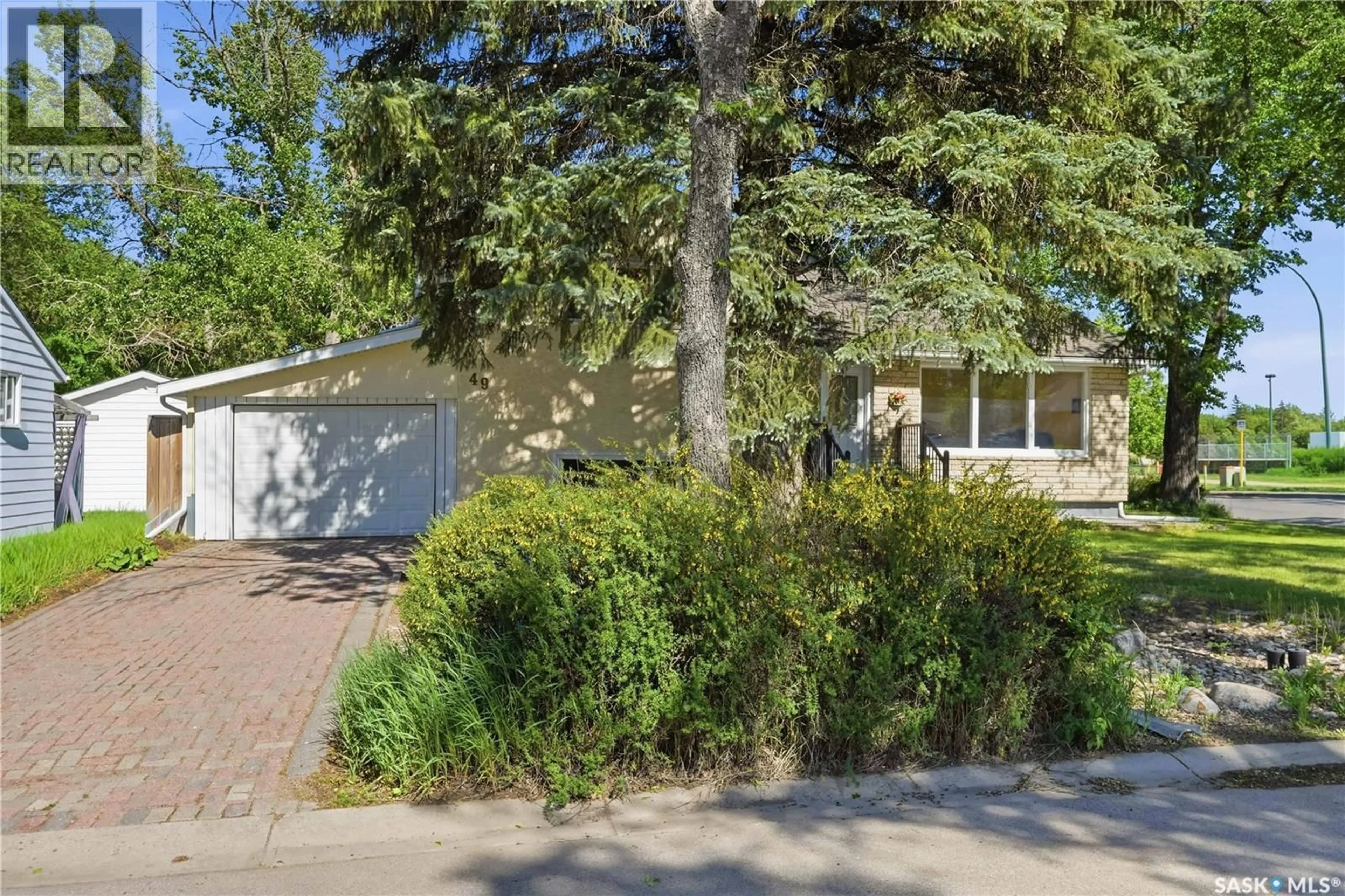 Home with vinyl exterior material, street for 49 SCOTT STREET, Regina Saskatchewan S4S4A1