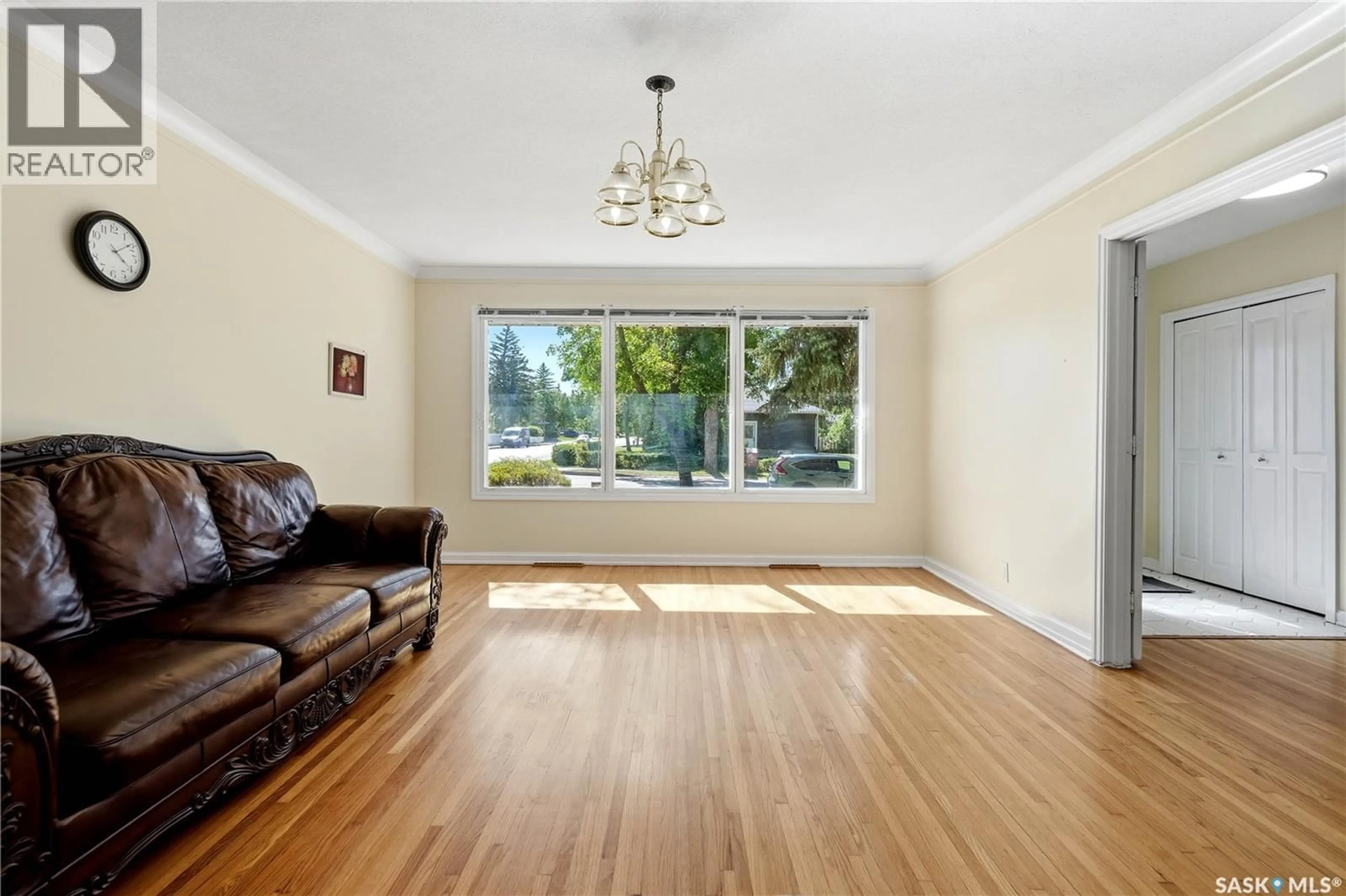 Living room with furniture, wood/laminate floor for 49 SCOTT STREET, Regina Saskatchewan S4S4A1