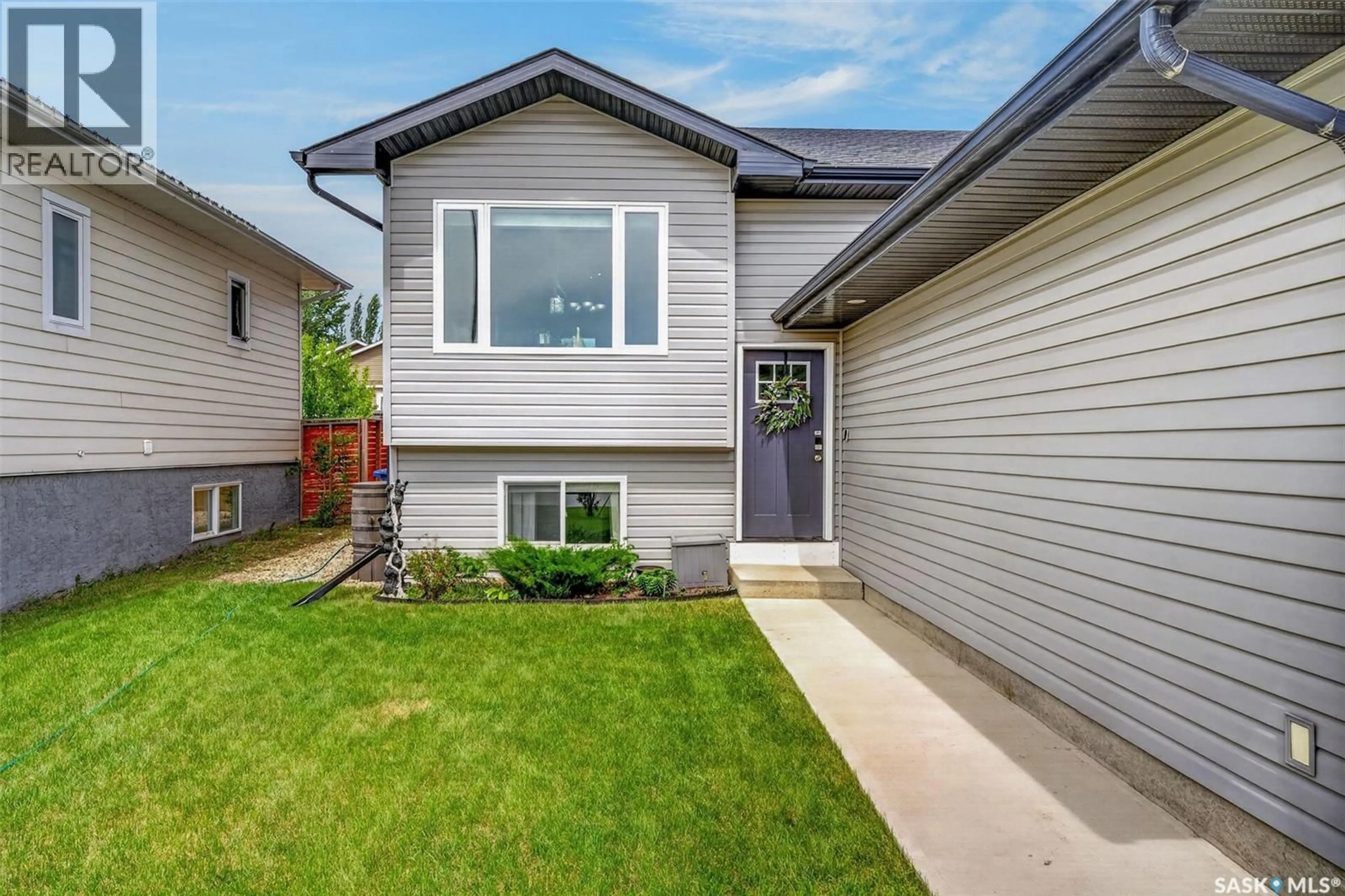 Home with vinyl exterior material, street for 203 SASKATCHEWAN AVENUE, Humboldt Saskatchewan S0K2A0