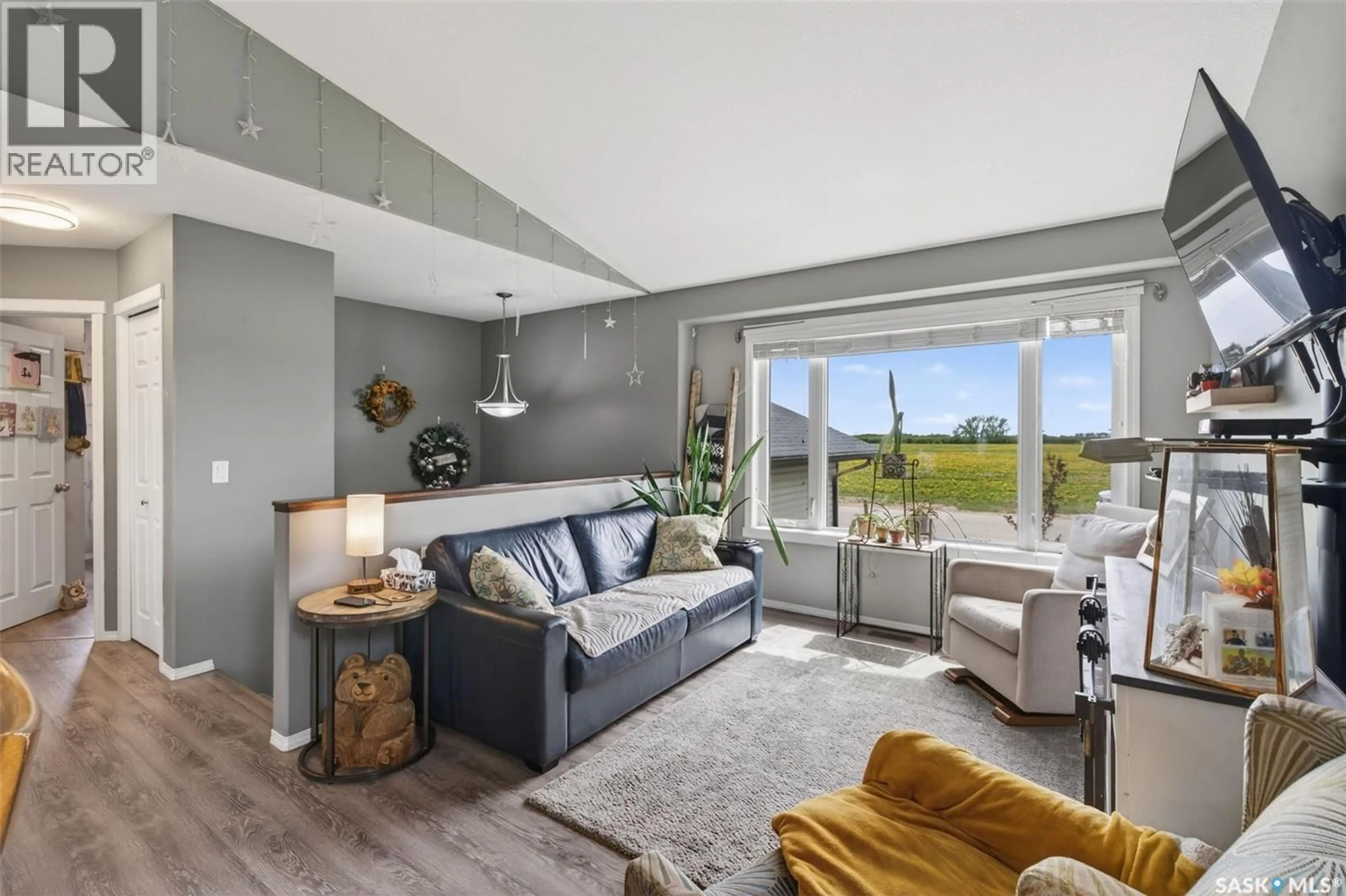Living room with furniture, unknown for 203 SASKATCHEWAN AVENUE, Humboldt Saskatchewan S0K2A0
