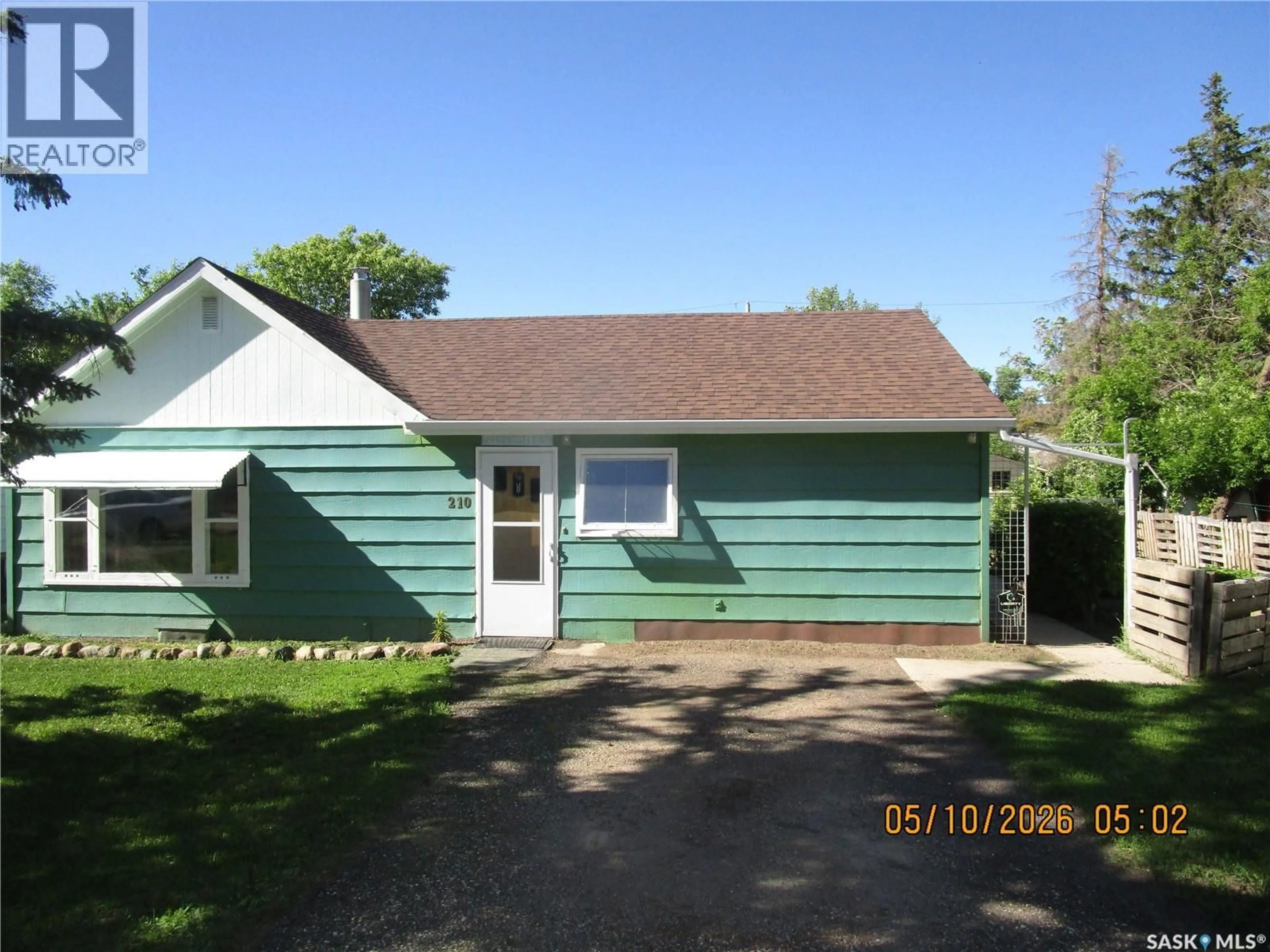 Home with vinyl exterior material, street for 210 7TH AVENUE, Assiniboia Saskatchewan S0H0B0