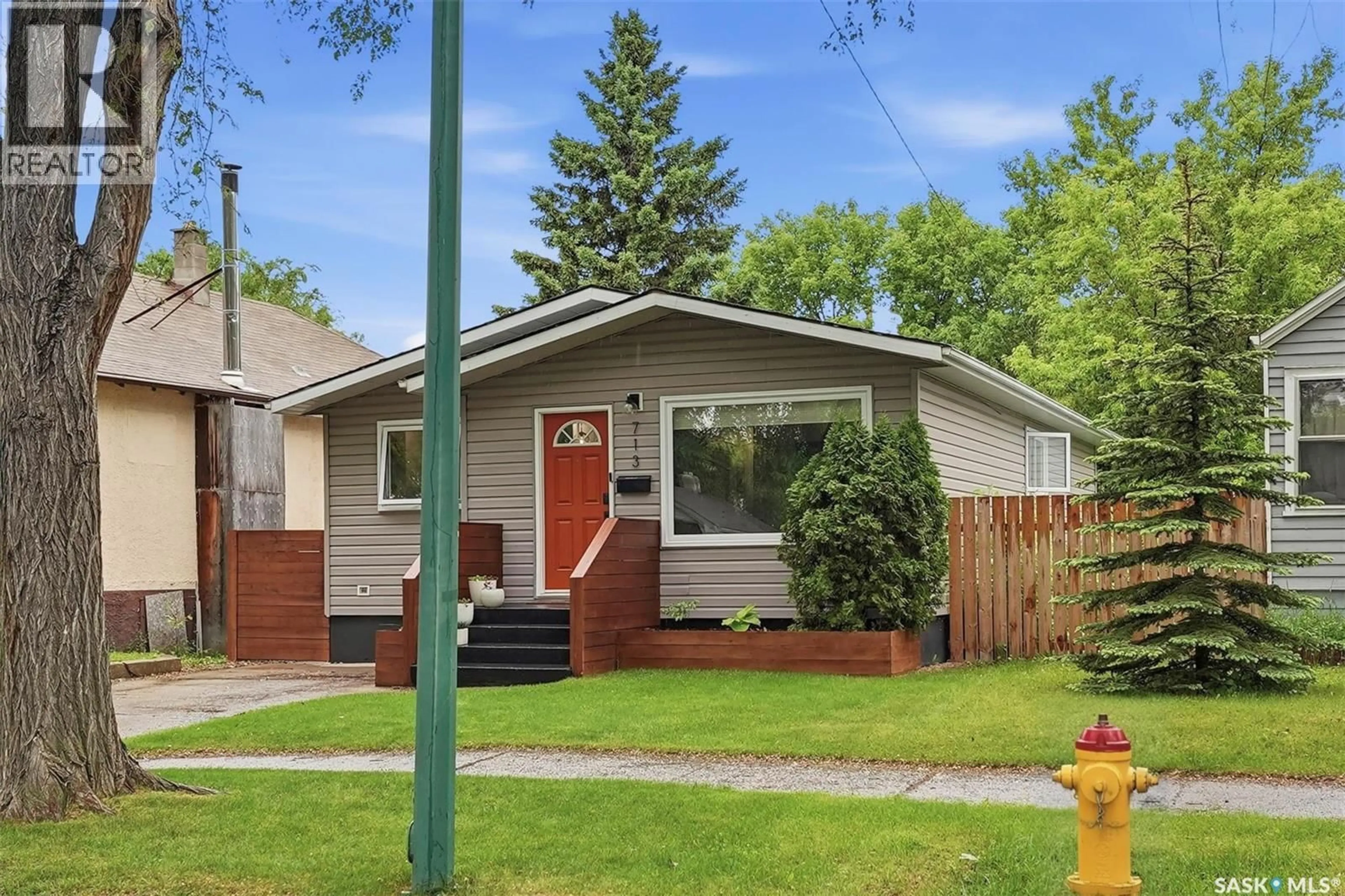 Home with vinyl exterior material, street for 713 6TH STREET, Saskatoon Saskatchewan S7H1C5