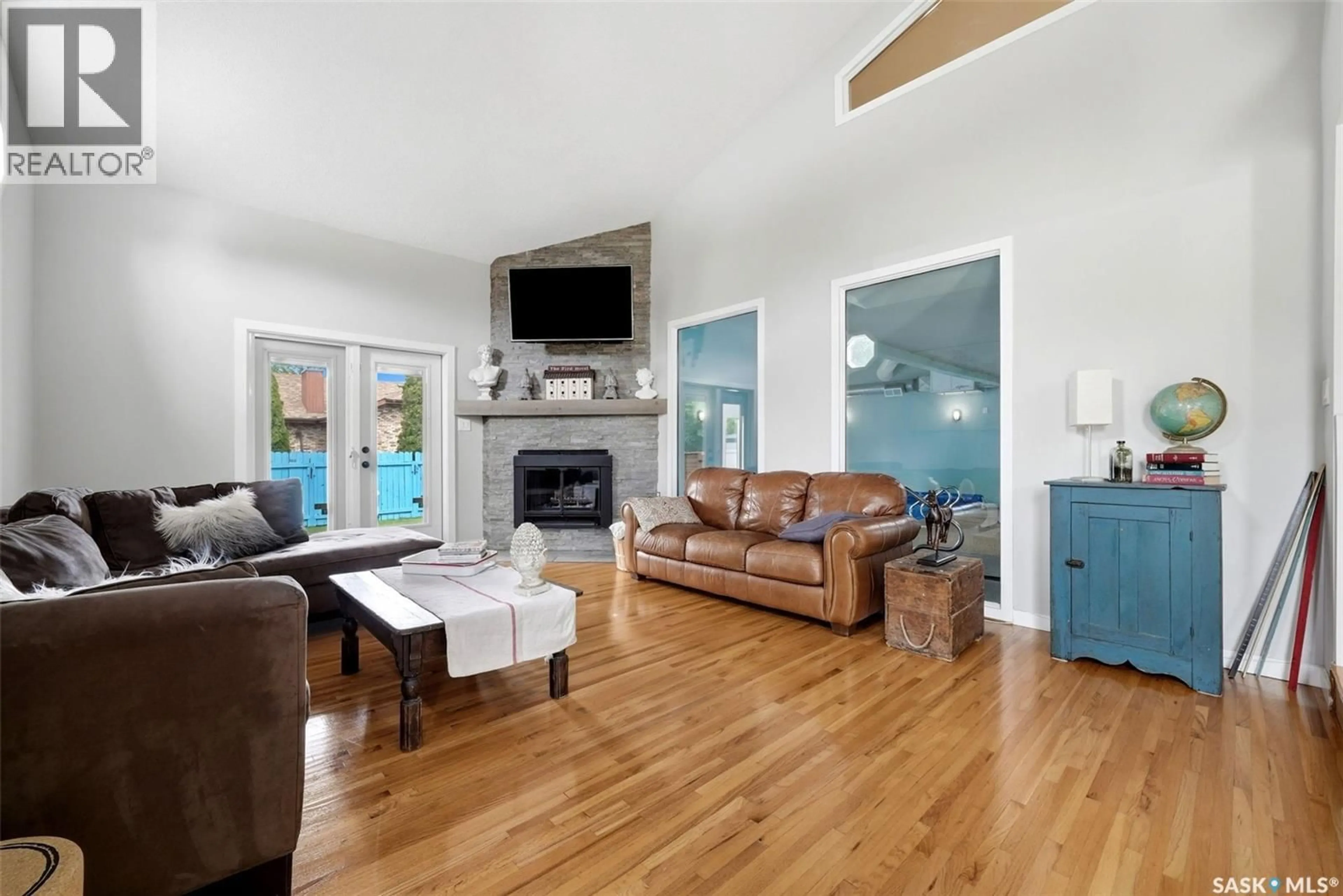 Living room with furniture, wood/laminate floor for 3355 WESTMINSTER ROAD, Regina Saskatchewan S4V1A7