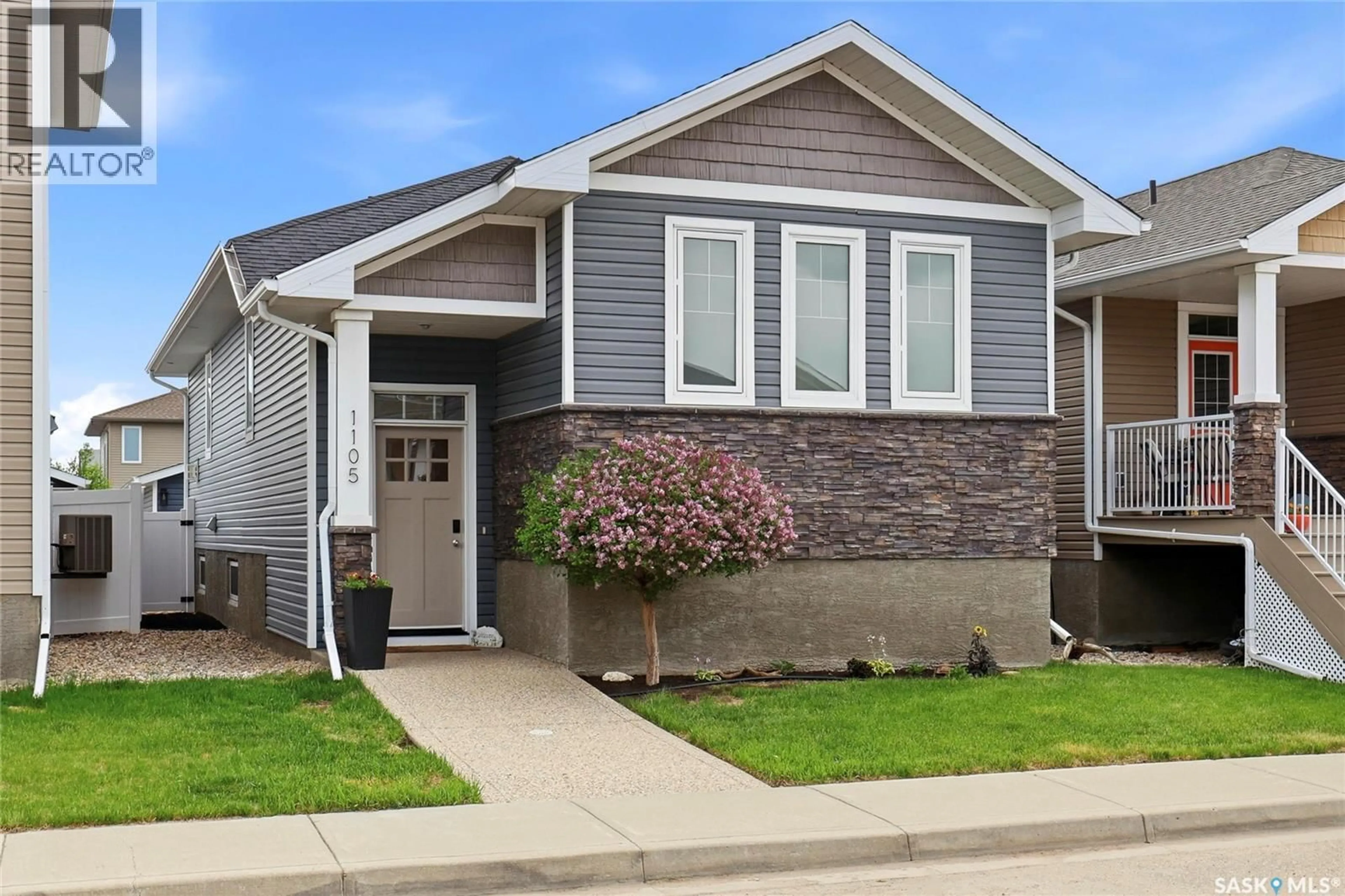 Home with vinyl exterior material, street for 1105 JURASIN STREET, Regina Saskatchewan S4X0K1