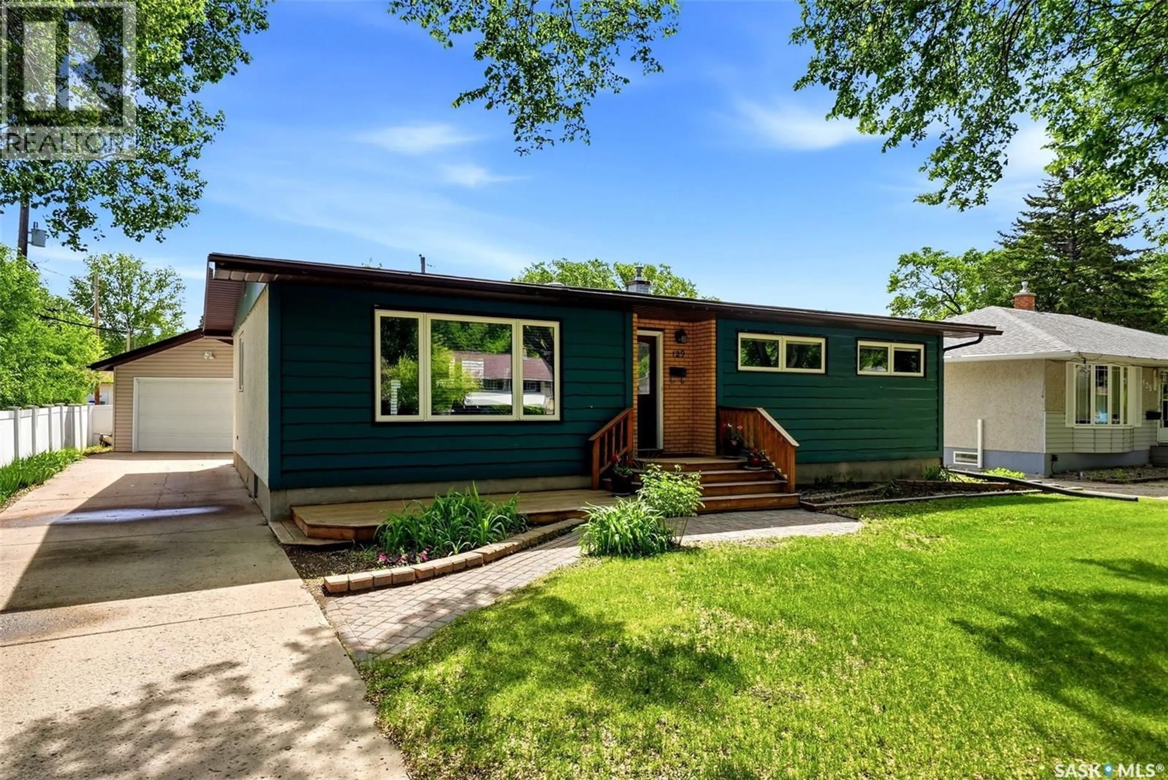 Home with vinyl exterior material, street for 129 MCKEE CRESCENT, Regina Saskatchewan S4S5N7