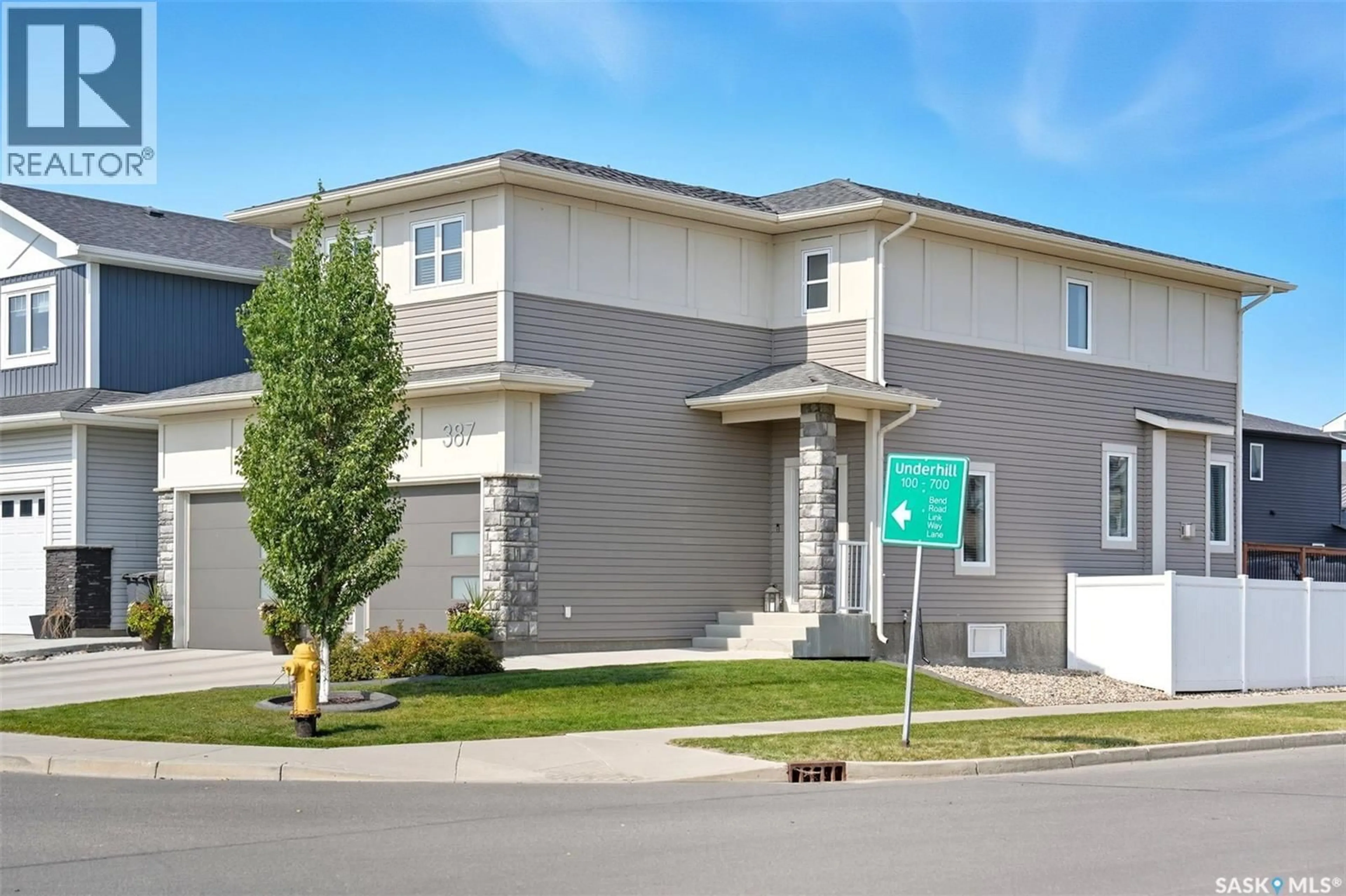 Home with vinyl exterior material, street for 387 UNDERHILL BEND, Saskatoon Saskatchewan S7V0N1