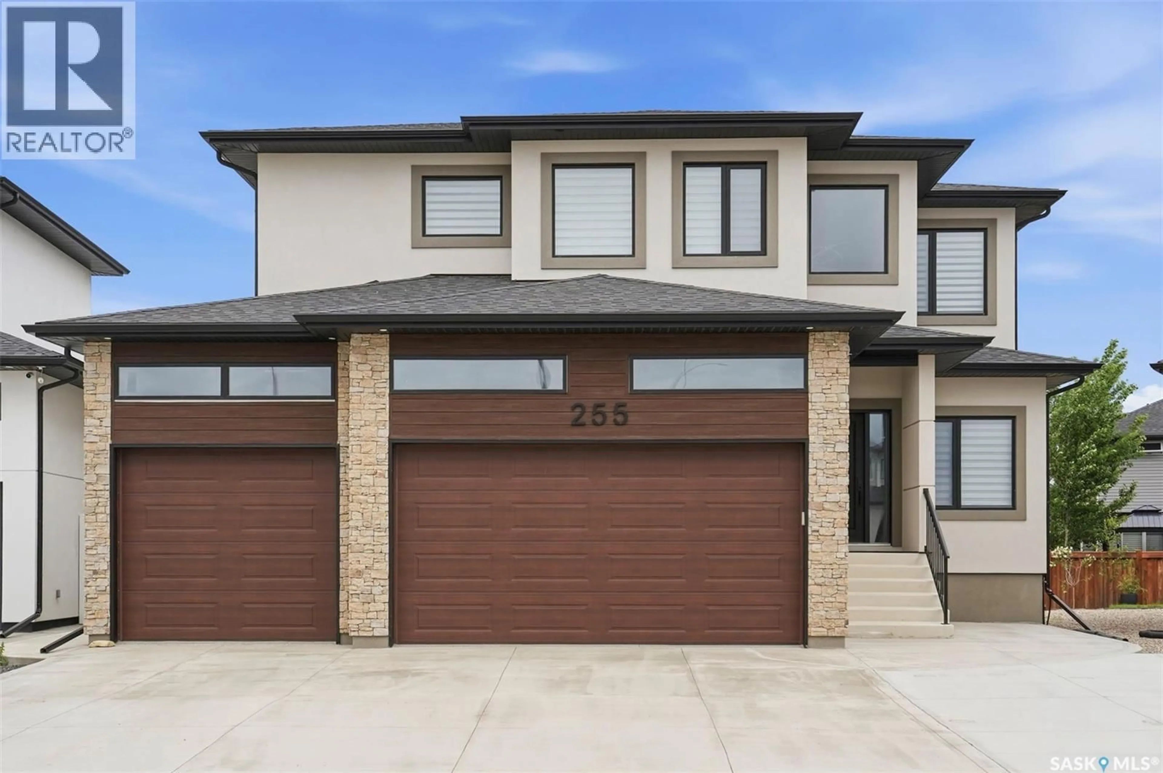 Home with brick exterior material, street for 255 FLYNN COVE, Saskatoon Saskatchewan S7V0J8