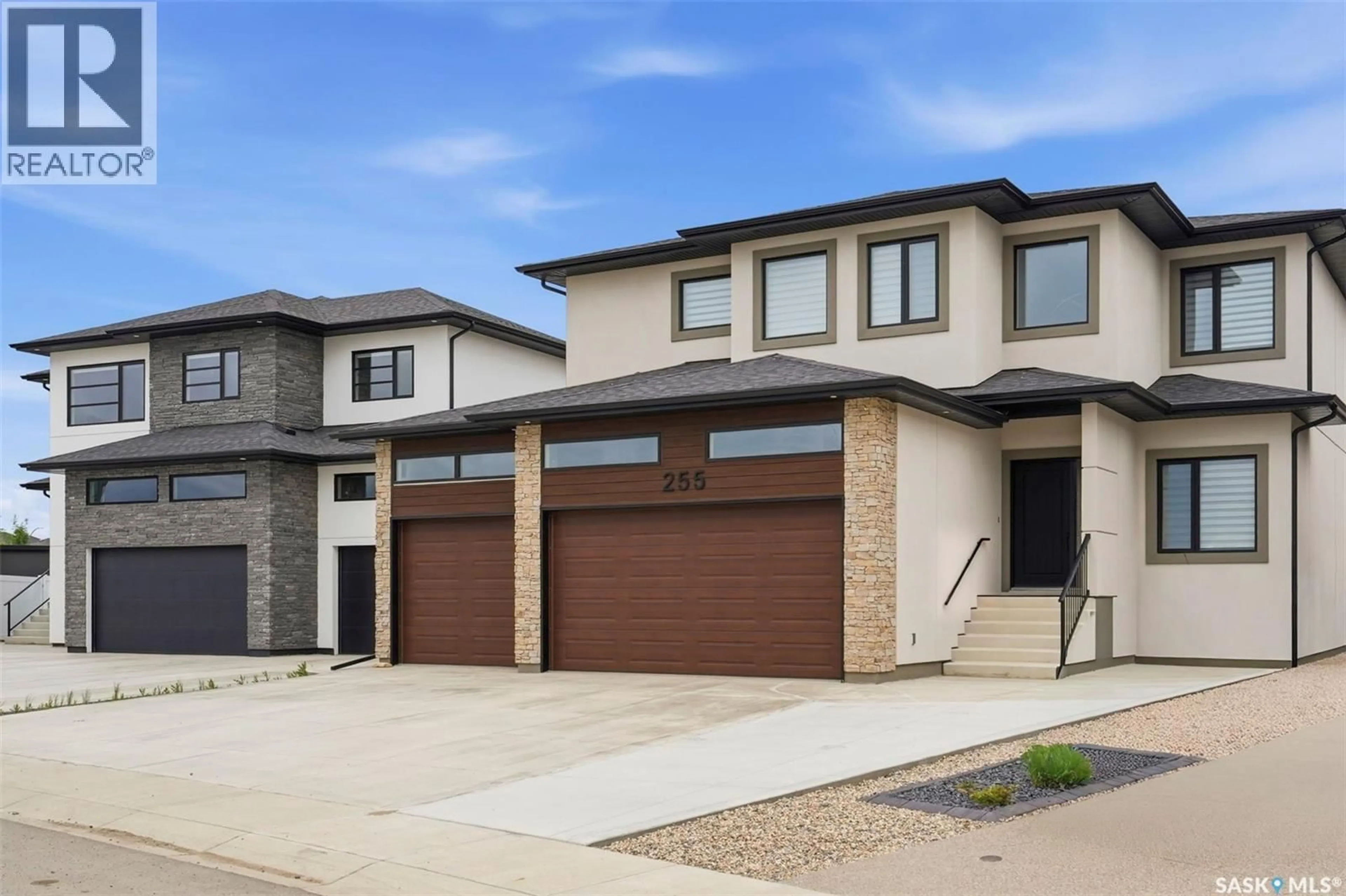 Home with brick exterior material, street for 255 FLYNN COVE, Saskatoon Saskatchewan S7V0J8