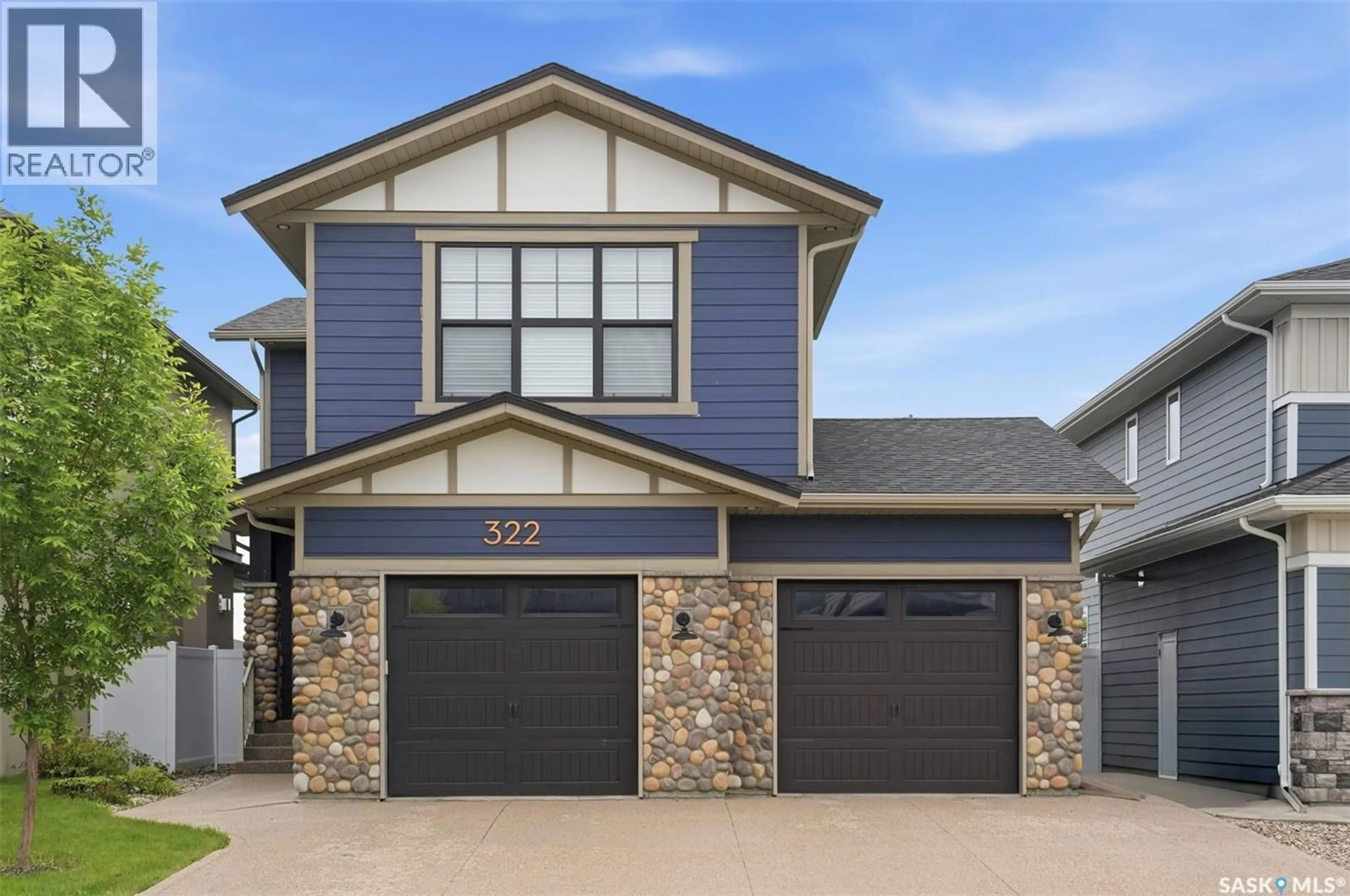 Home with vinyl exterior material, street for 322 DAGNONE CRESCENT, Saskatoon Saskatchewan S7V0P7