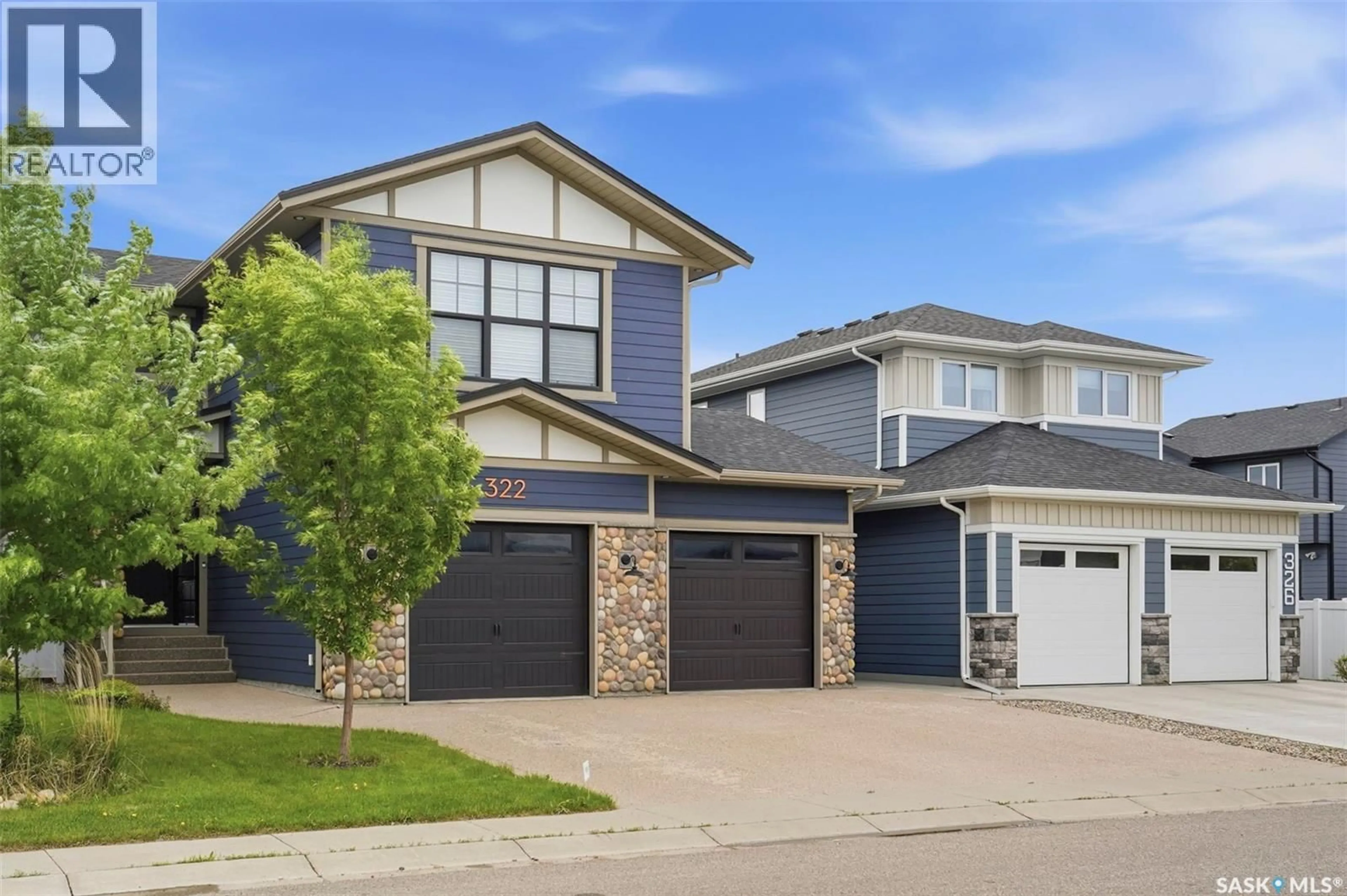 Home with vinyl exterior material, street for 322 DAGNONE CRESCENT, Saskatoon Saskatchewan S7V0P7